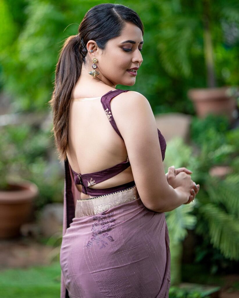 Divi Shines with Backless Saree Style