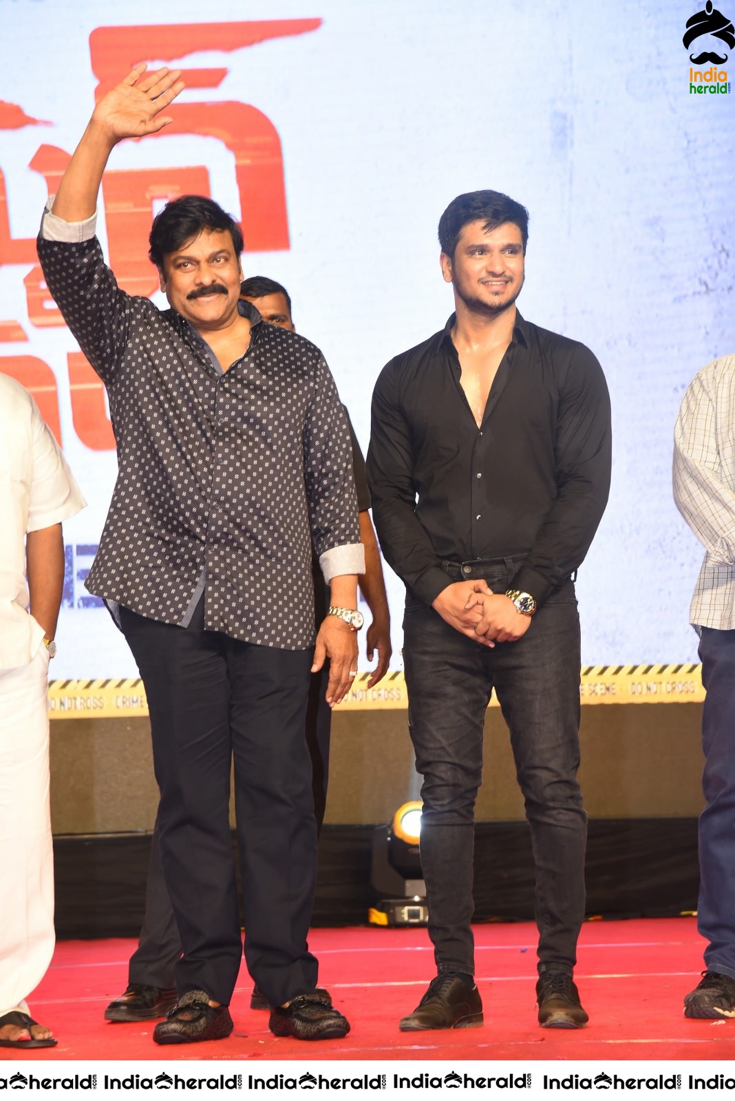 Actor Nikhil Siddhartha on the stage with Mega Star