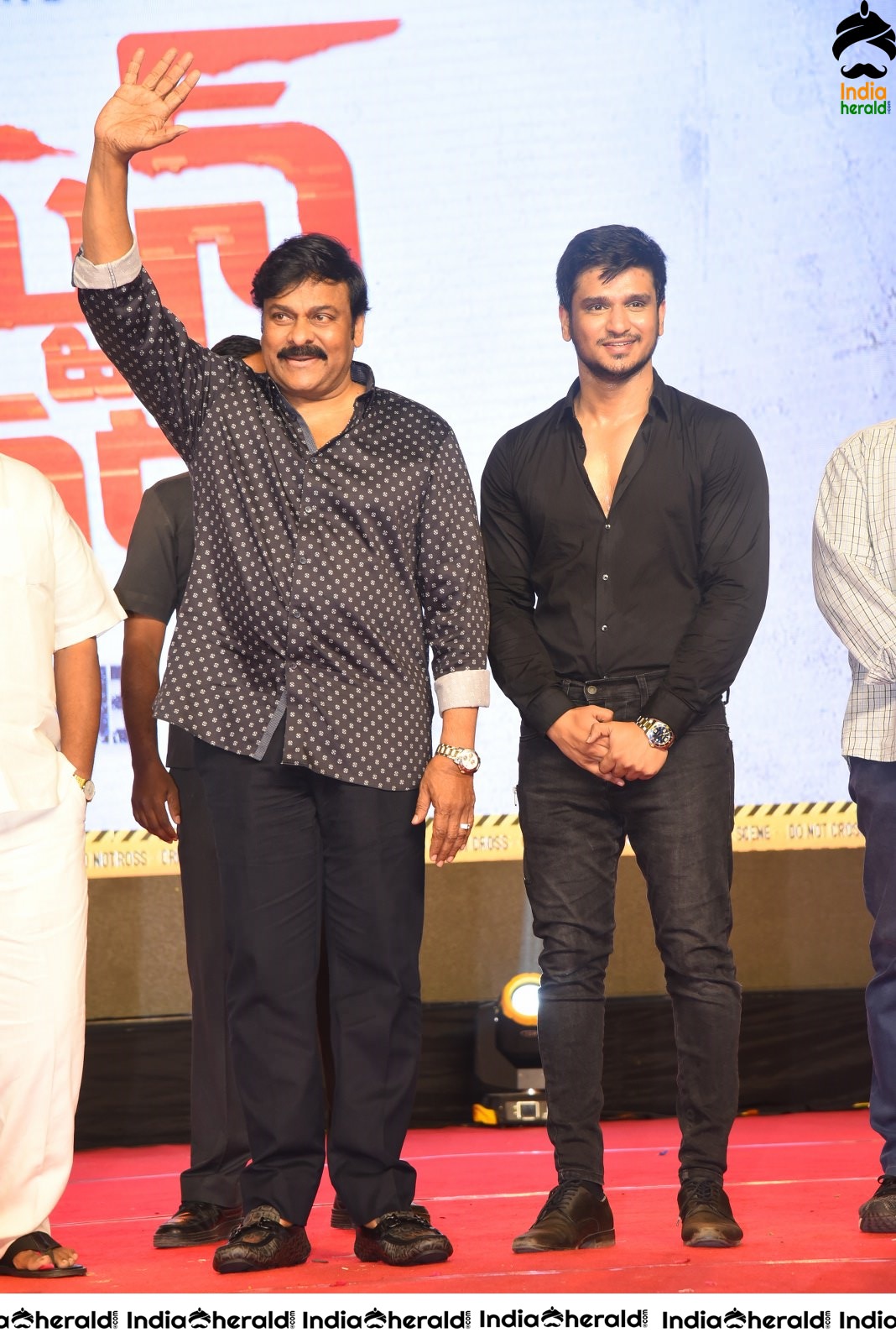 Actor Nikhil Siddhartha on the stage with Mega Star