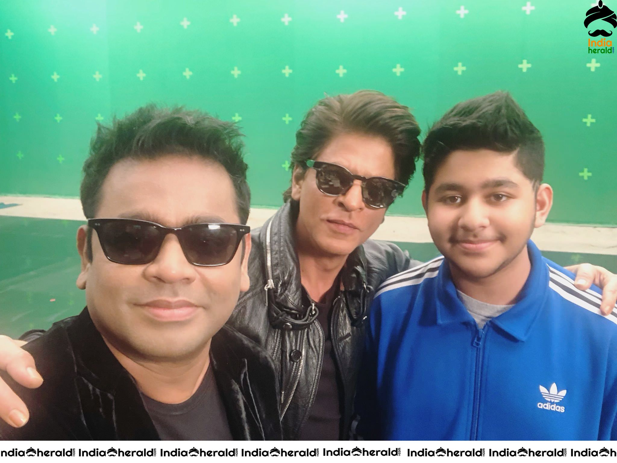 Actor Shah Rukh Khan is seen with A R Rahman and his son A R Ameen