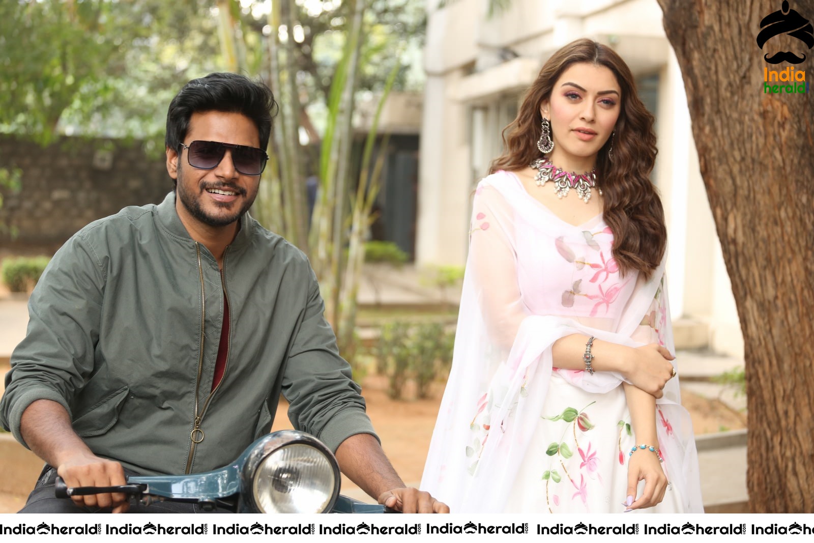 Actor Sundeep Kishan takes Photos along with Hansika sitting behind him in a Scooter Set 1