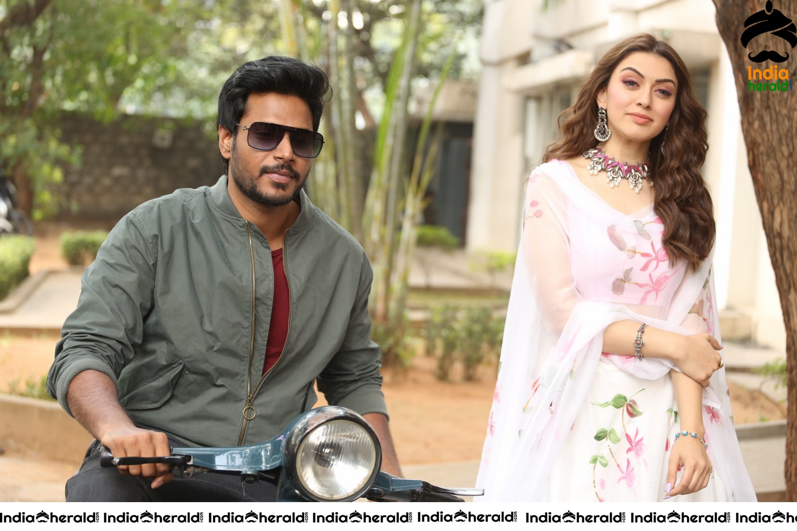 Actor Sundeep Kishan takes Photos along with Hansika sitting behind him in a Scooter Set 1