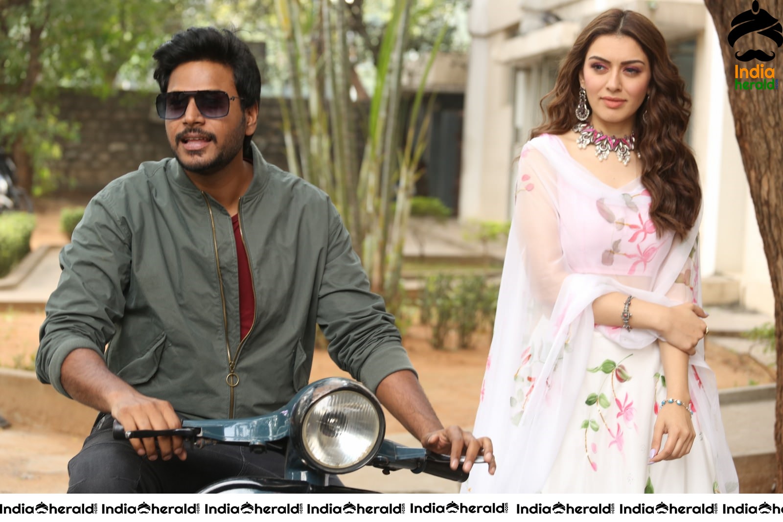 Actor Sundeep Kishan takes Photos along with Hansika sitting behind him in a Scooter Set 1