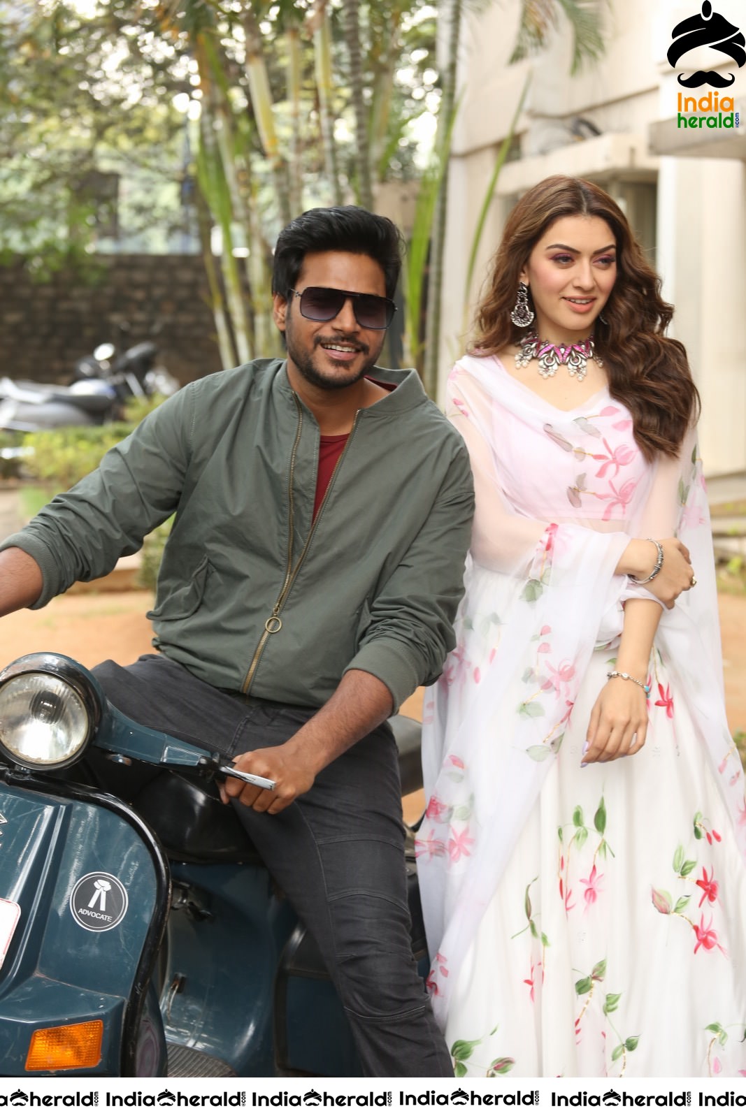 Actor Sundeep Kishan takes Photos along with Hansika sitting behind him in a Scooter Set 1