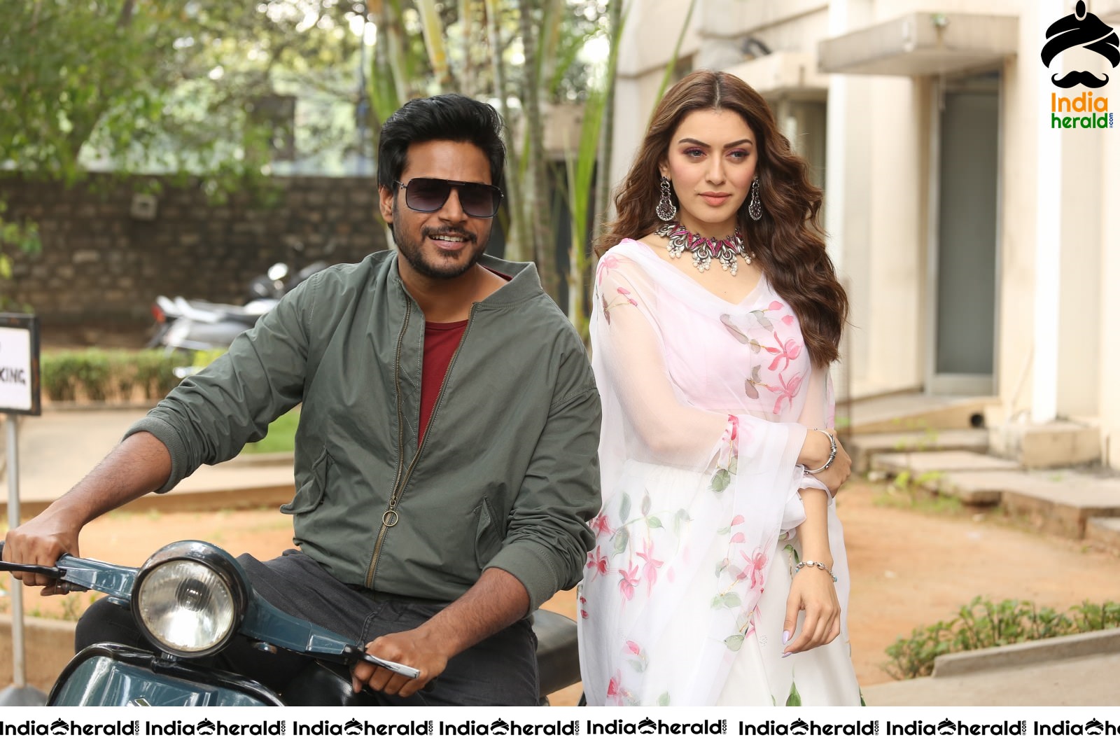 Actor Sundeep Kishan takes Photos along with Hansika sitting behind him in a Scooter Set 1