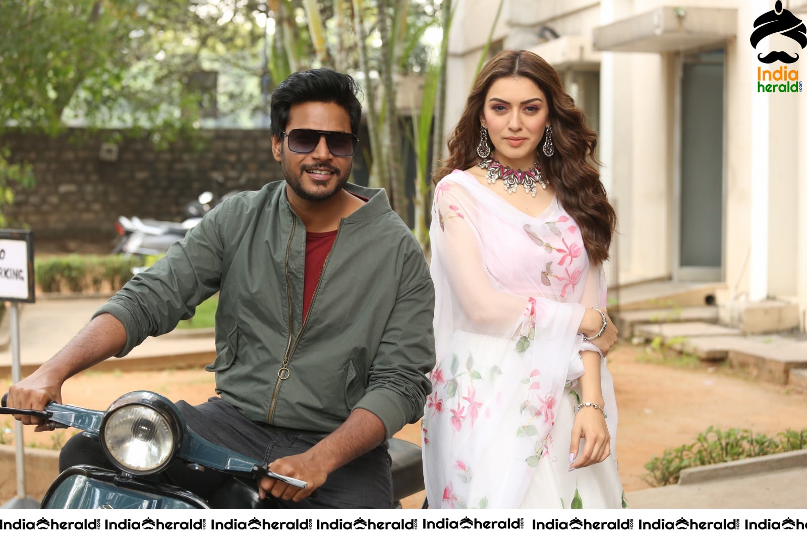 Actor Sundeep Kishan takes Photos along with Hansika sitting behind him in a Scooter Set 1