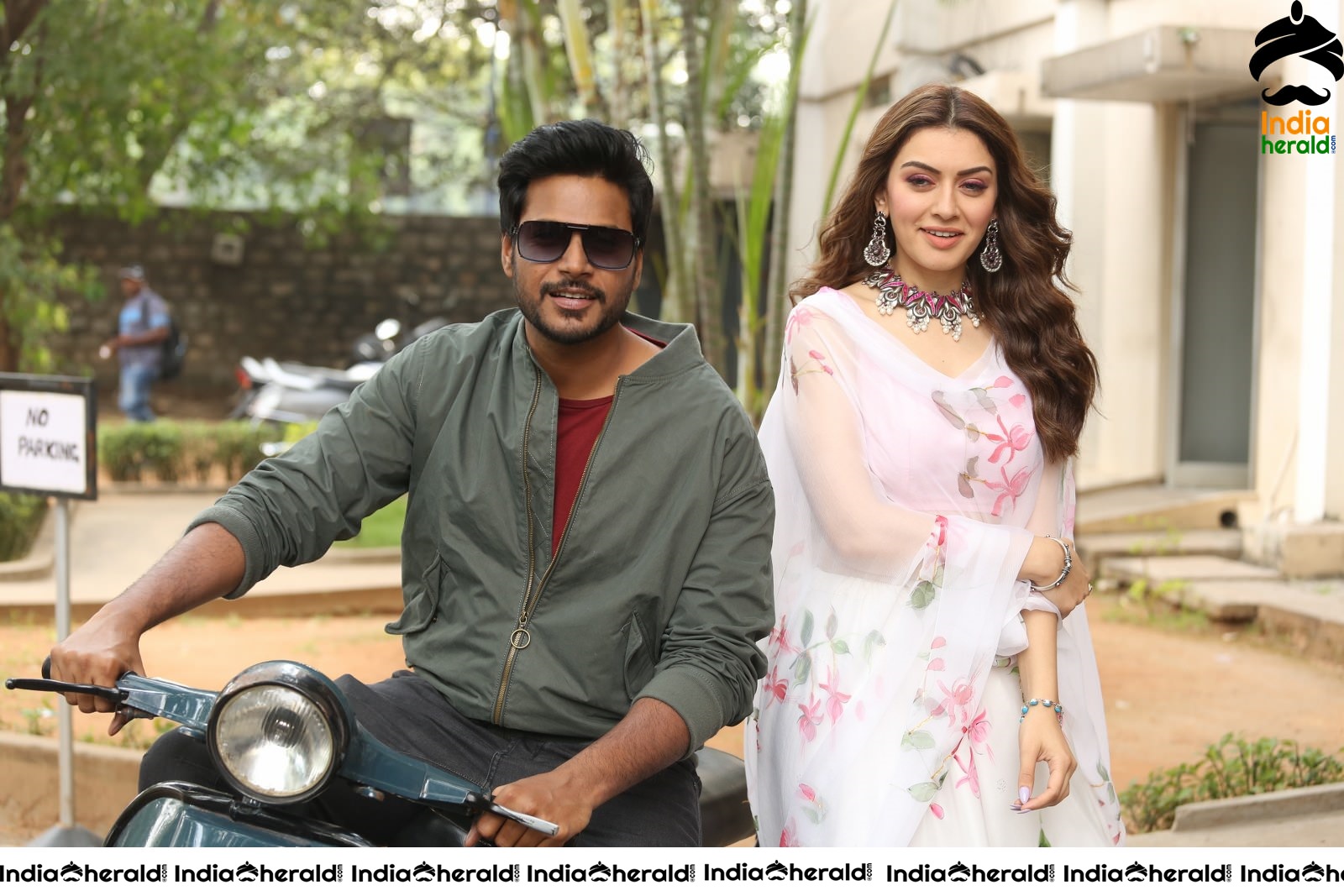 Actor Sundeep Kishan takes Photos along with Hansika sitting behind him in a Scooter Set 1