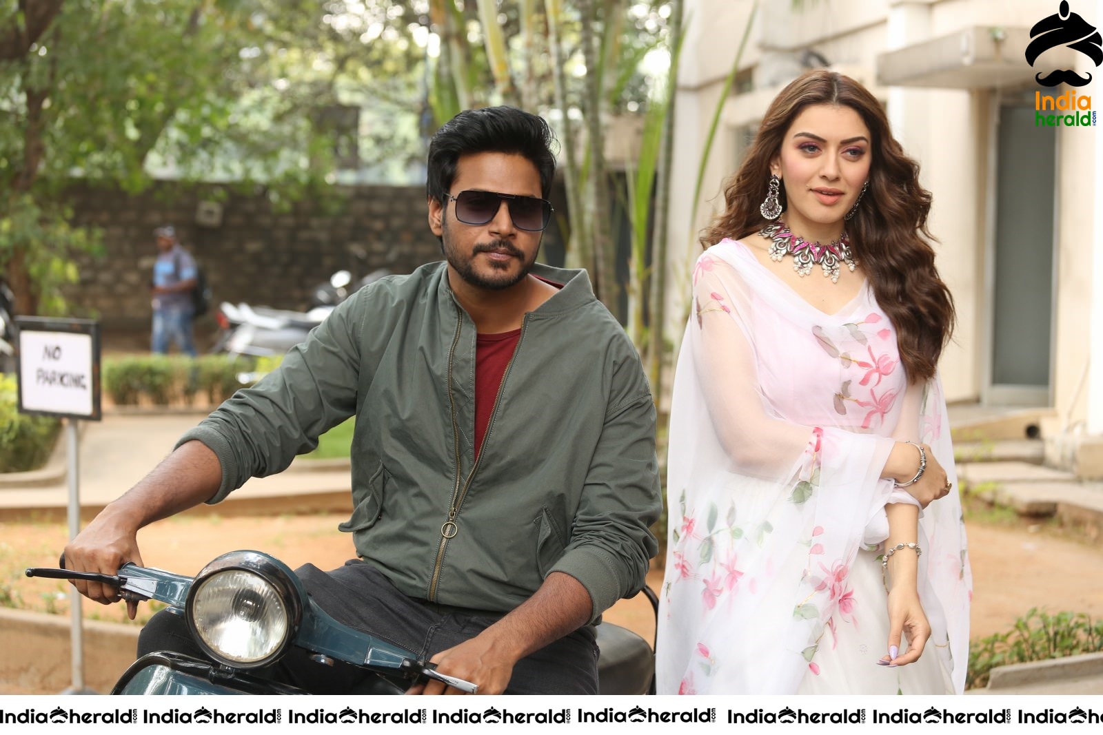 Actor Sundeep Kishan takes Photos along with Hansika sitting behind him in a Scooter Set 1