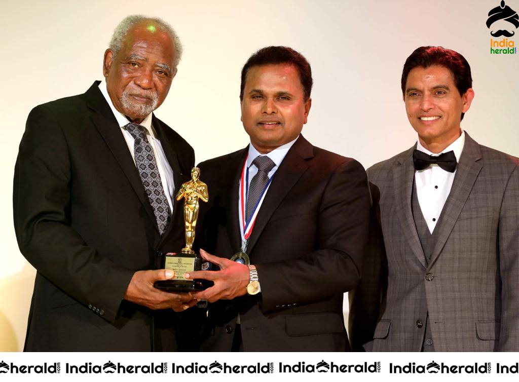 Film Maker Tel K Ganesan Receiving the Award at USA