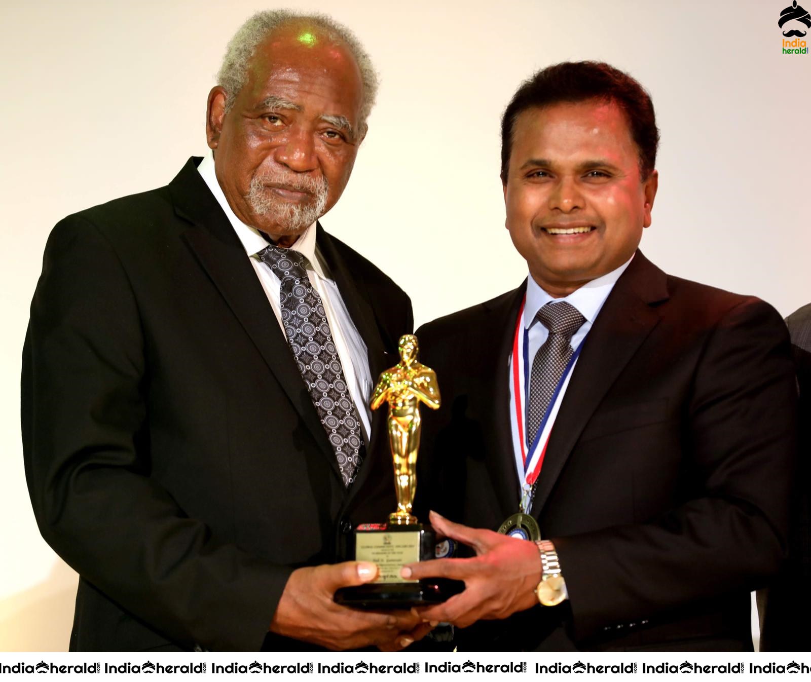 Film Maker Tel K Ganesan Receiving the Award at USA