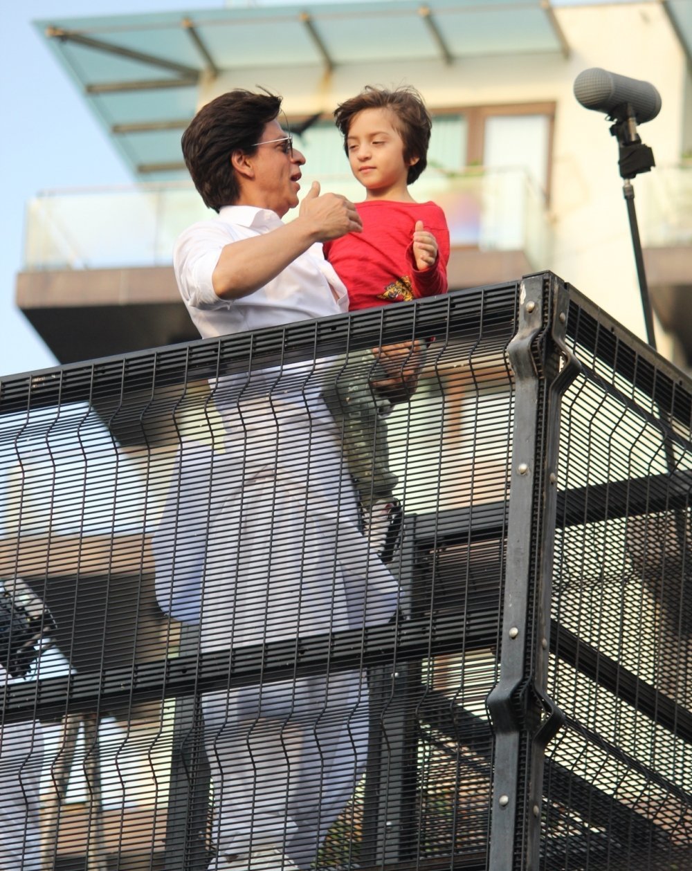 Shahrukh Khan With His Son AbRam Khan During A Fan Meet From House Balcony