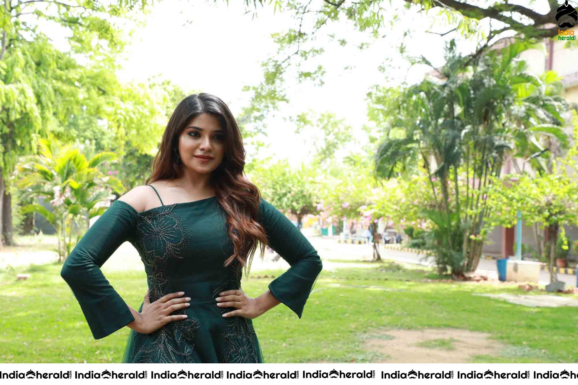 Aathmika Hot Photoshoot Stills in Dark Green Attire Set 1