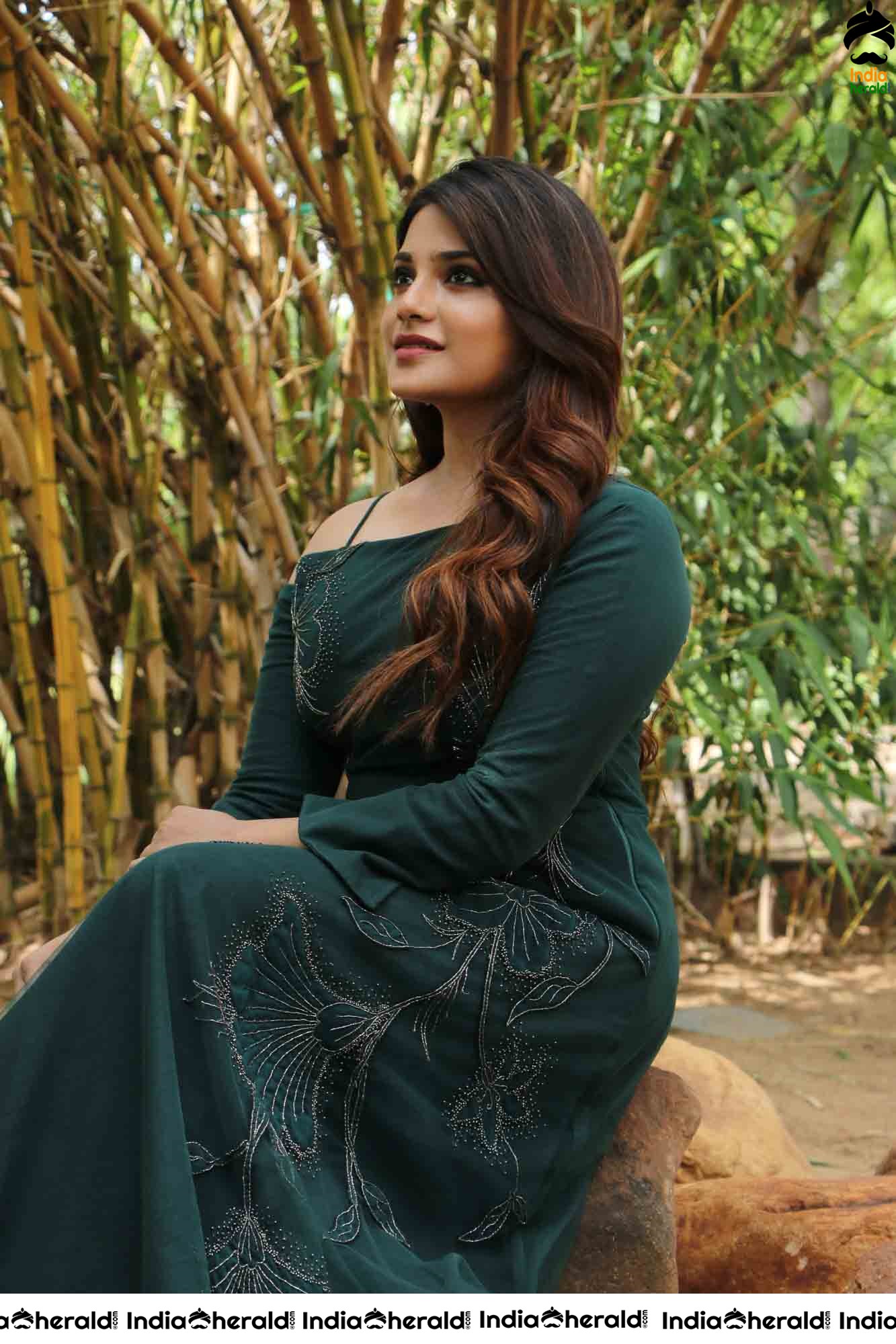 Aathmika Hot Photoshoot Stills in Dark Green Attire Set 2