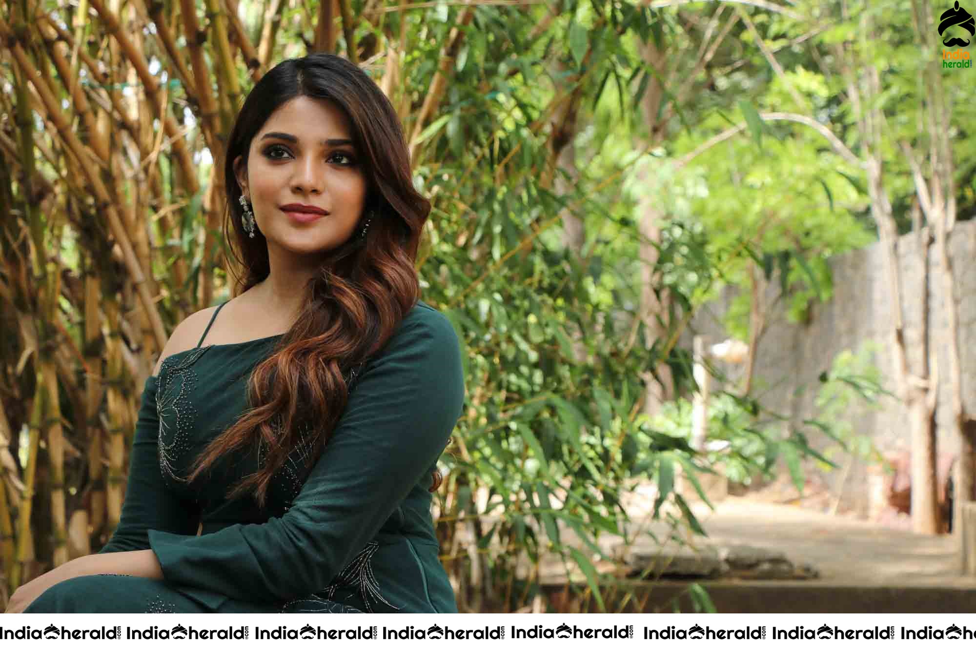 Aathmika Hot Photoshoot Stills in Dark Green Attire Set 2