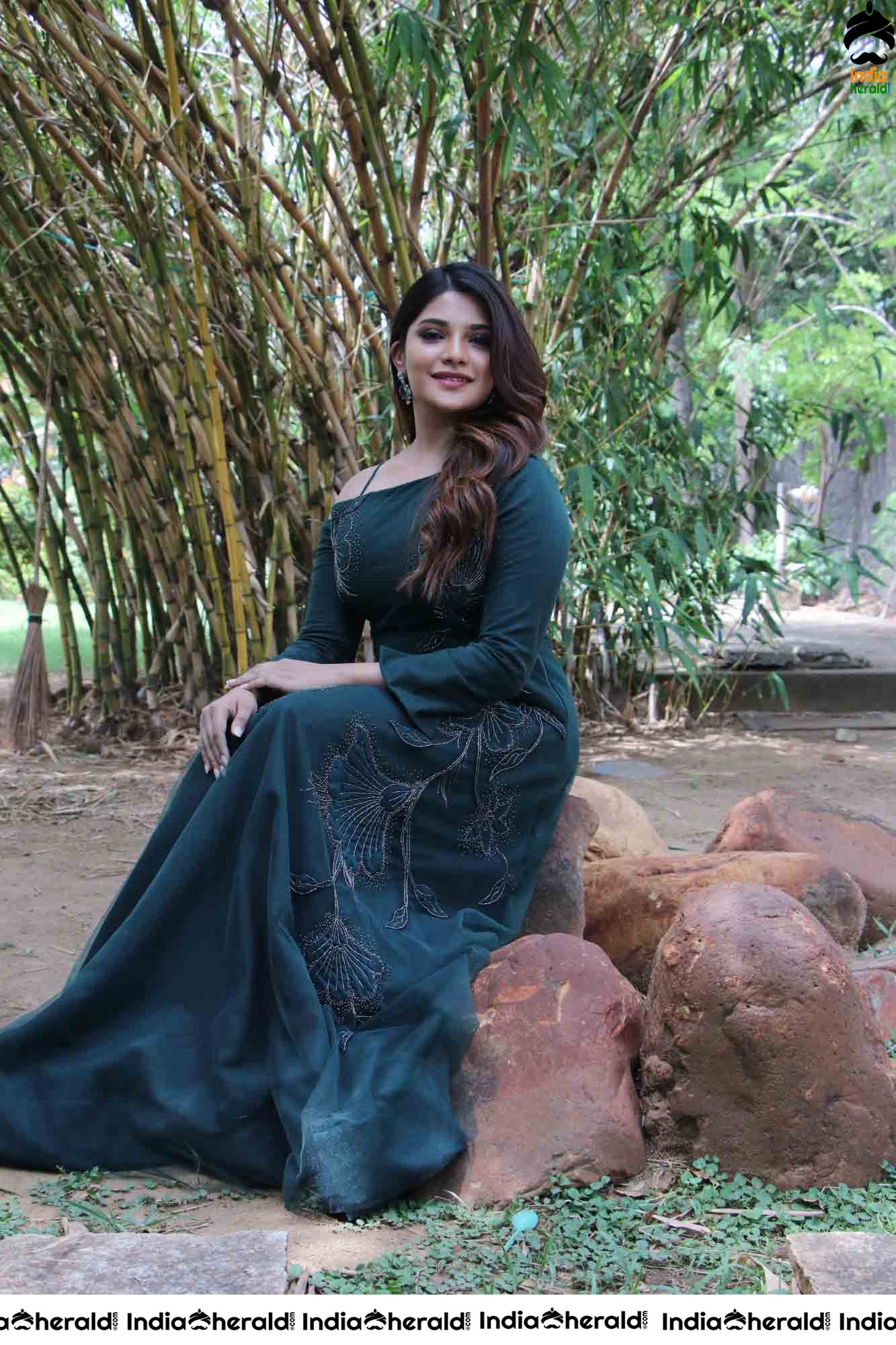 Aathmika Hot Photoshoot Stills in Dark Green Attire Set 2