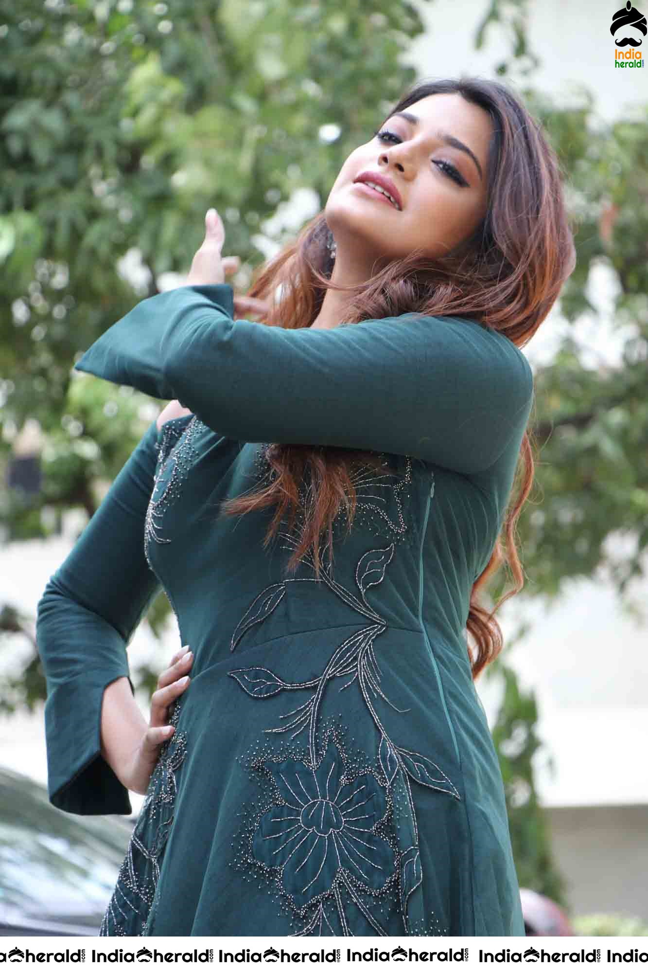 Aathmika Hot Photoshoot Stills in Dark Green Attire Set 2