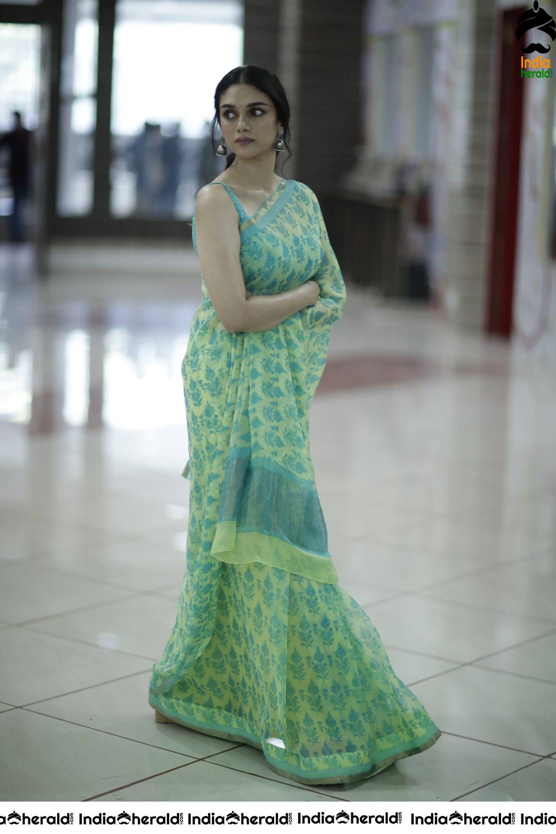 Aditi Rao Mesmerizes in Sleeveless Blouse and Saree Looks