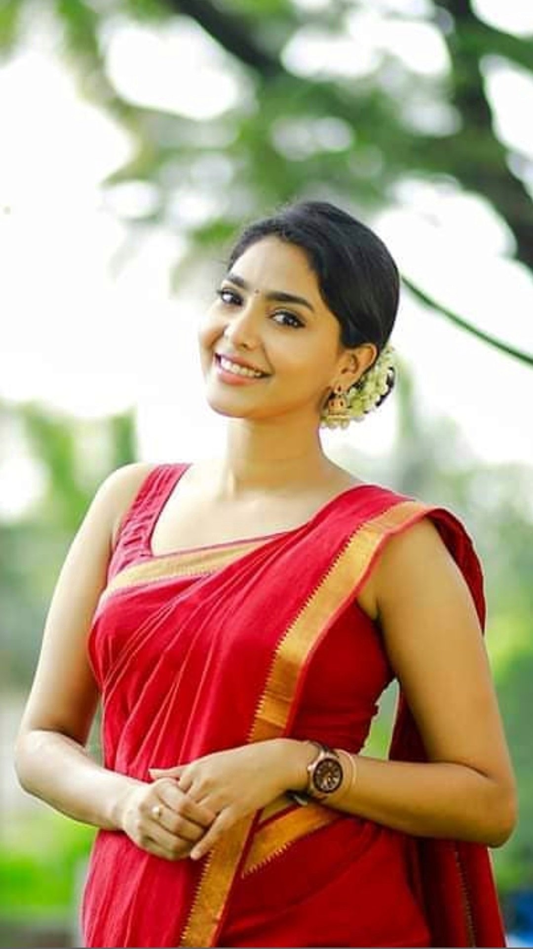 Aishwarya Lakshmi Latest Stills In Red Saree And Sleeveless Blouse