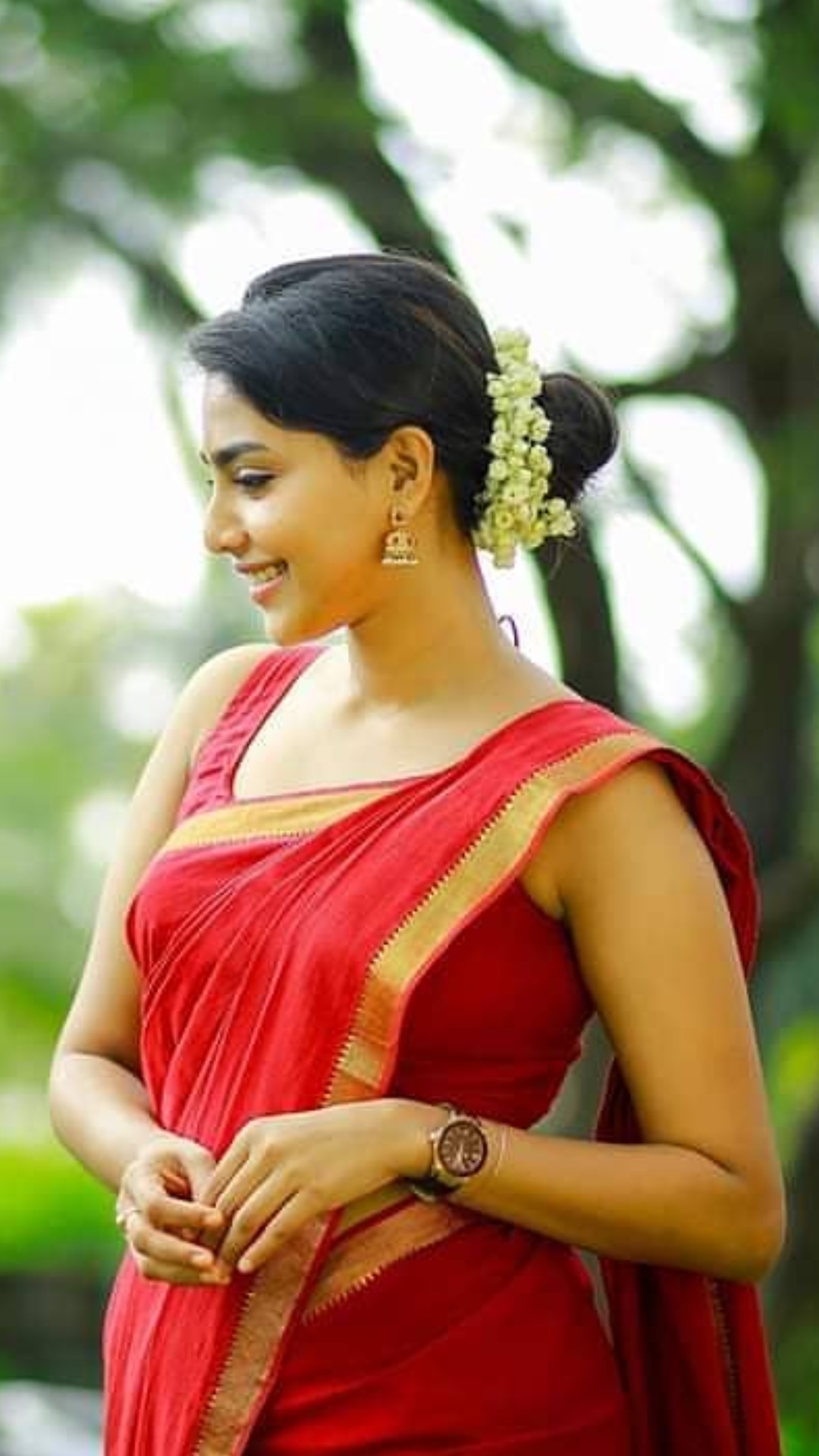 Aishwarya Lakshmi Latest Stills In Red Saree And Sleeveless Blouse