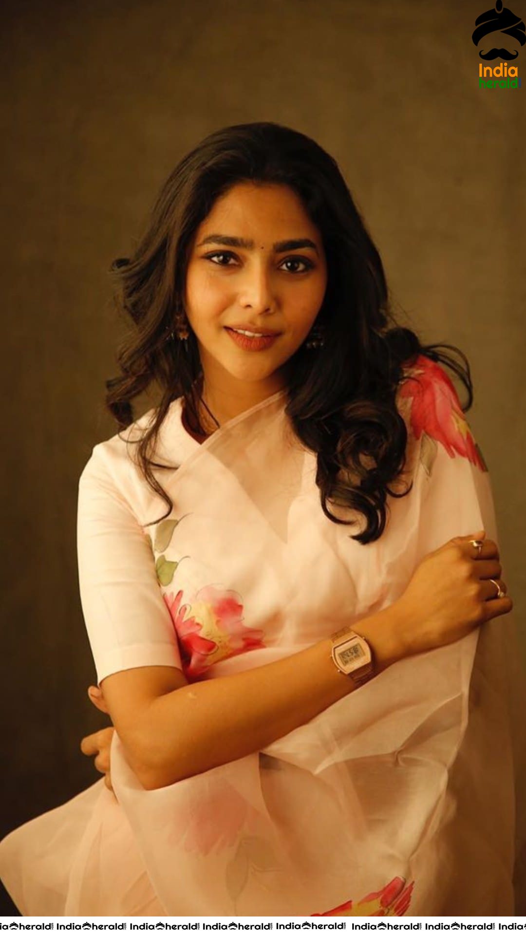 Aishwarya Lekshmi Hot in White Saree for the promotions of her Tamil debut Action