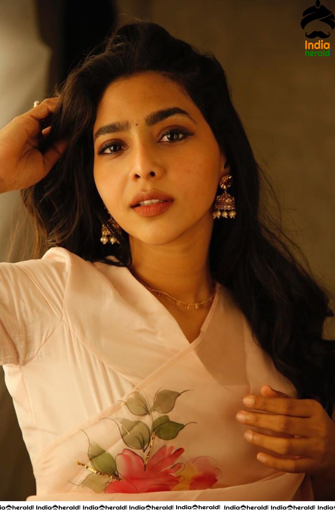 Aishwarya Lekshmi Hot in White Saree for the promotions of her Tamil debut Action