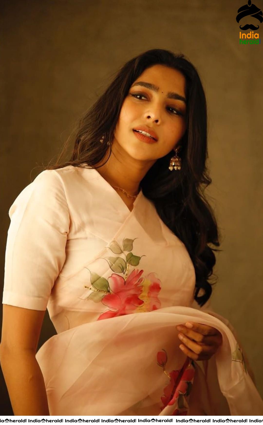 Aishwarya Lekshmi Hot in White Saree for the promotions of her Tamil debut Action