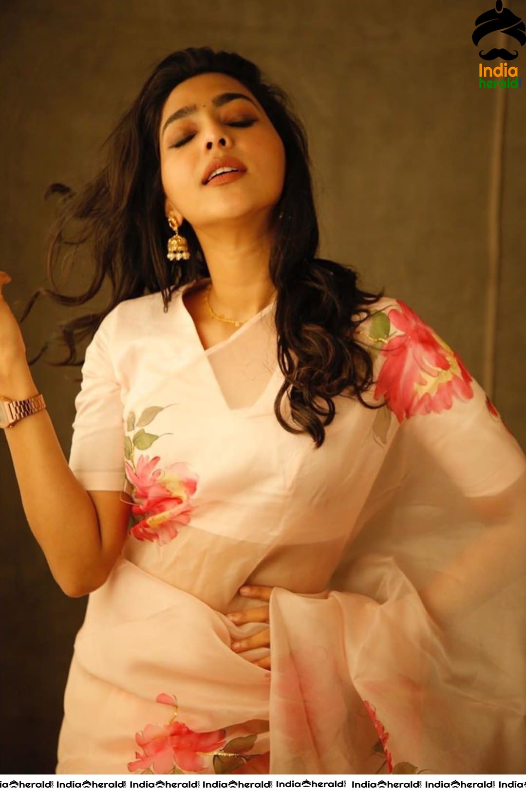 Aishwarya Lekshmi Hot in White Saree for the promotions of her Tamil debut Action