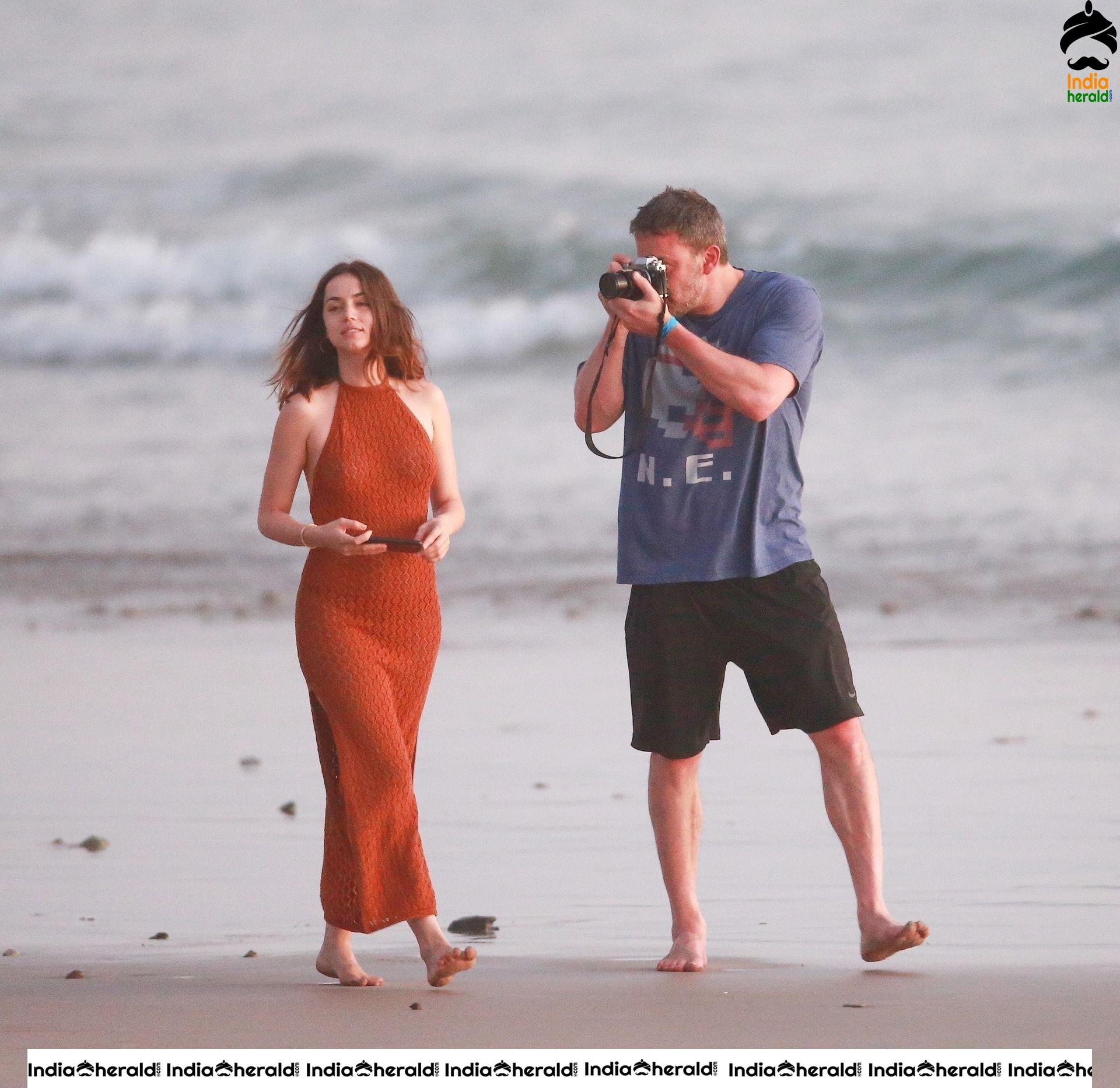 Ana De Armas enjoys a very romantic stroll in Sheer Red dress on the beach in Costa Rica