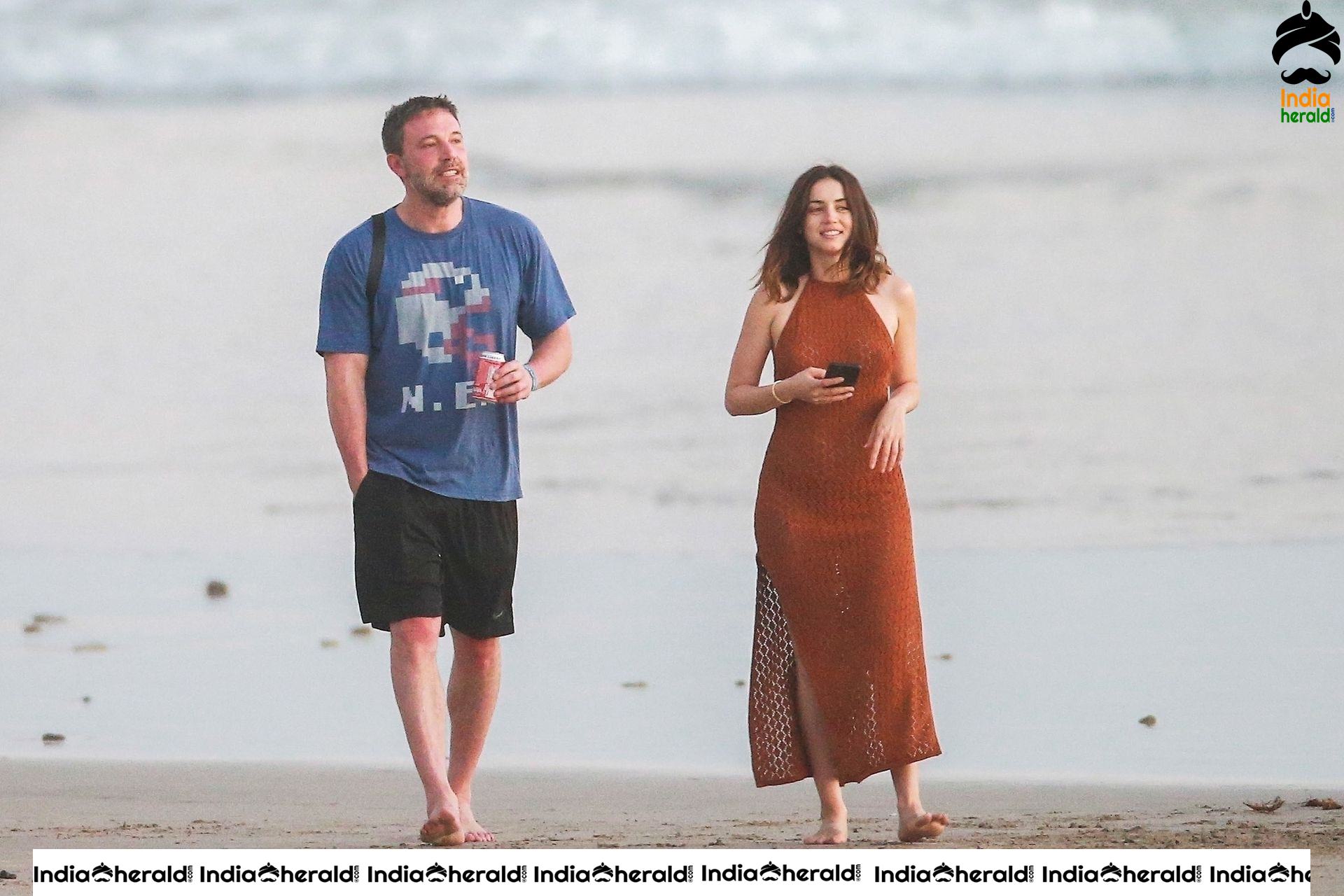 Ana De Armas enjoys a very romantic stroll in Sheer Red dress on the beach in Costa Rica