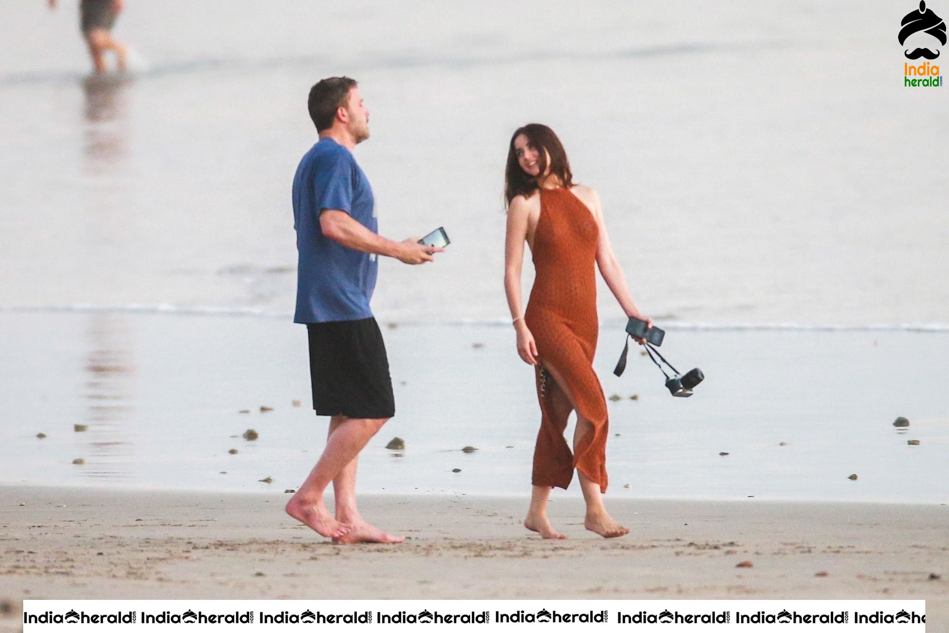 Ana De Armas enjoys a very romantic stroll in Sheer Red dress on the beach in Costa Rica