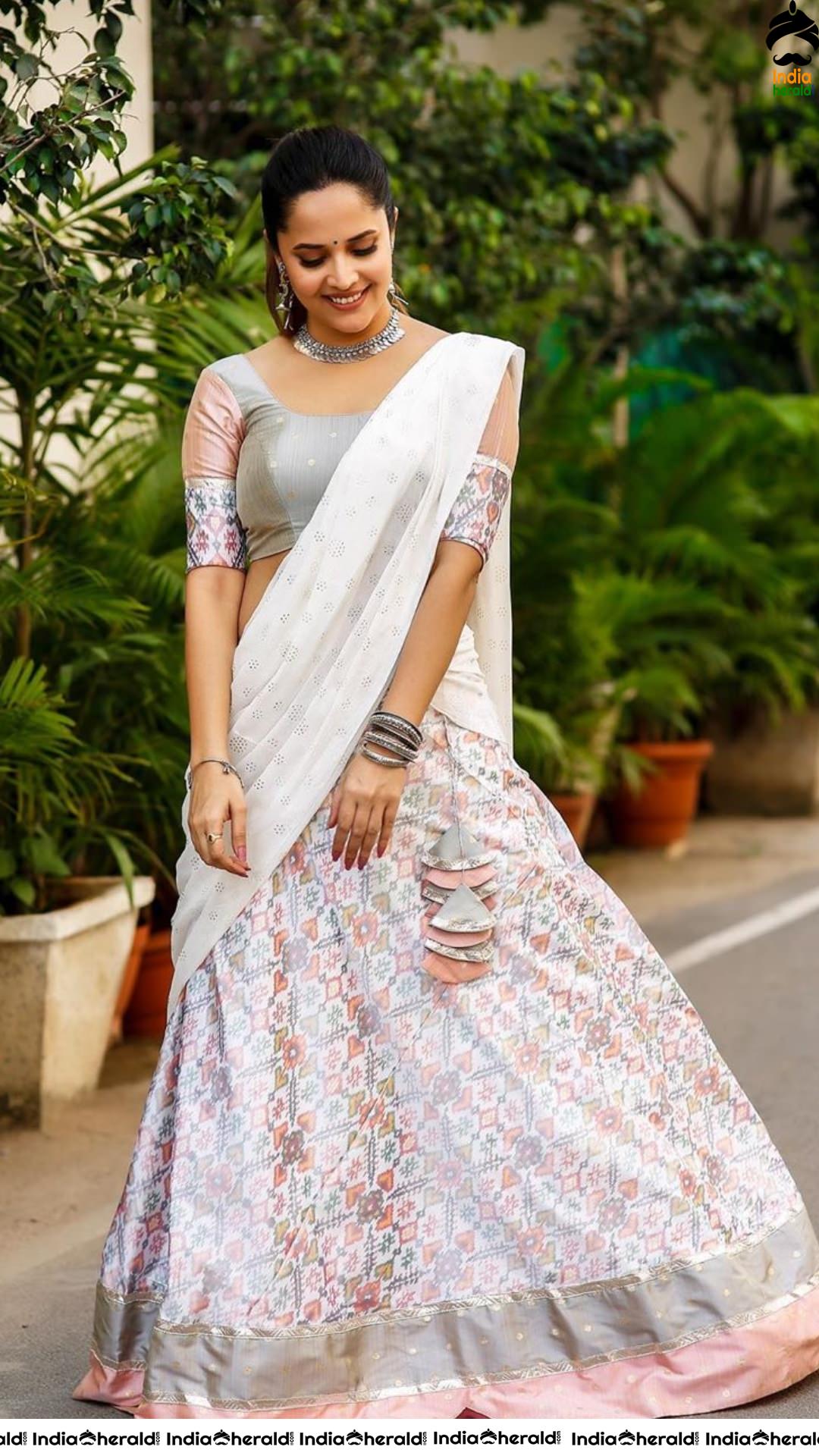 Anasuya Hot and Flaunting in White Saree