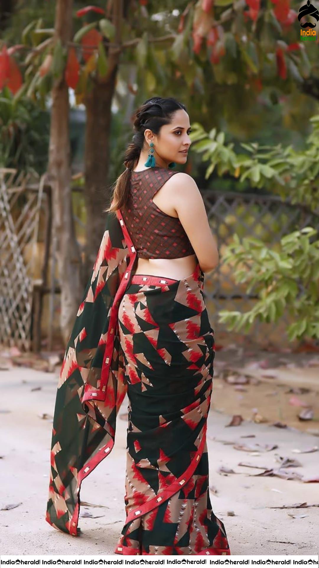 Anasuya Latest Seductive Teasing Photoshoot in Saree