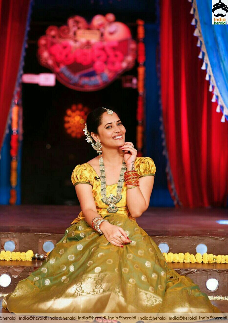 Anasuya looking gorgeous and resplendent in yellow traditional attire