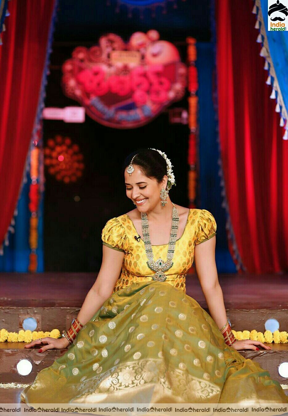 Anasuya looking gorgeous and resplendent in yellow traditional attire