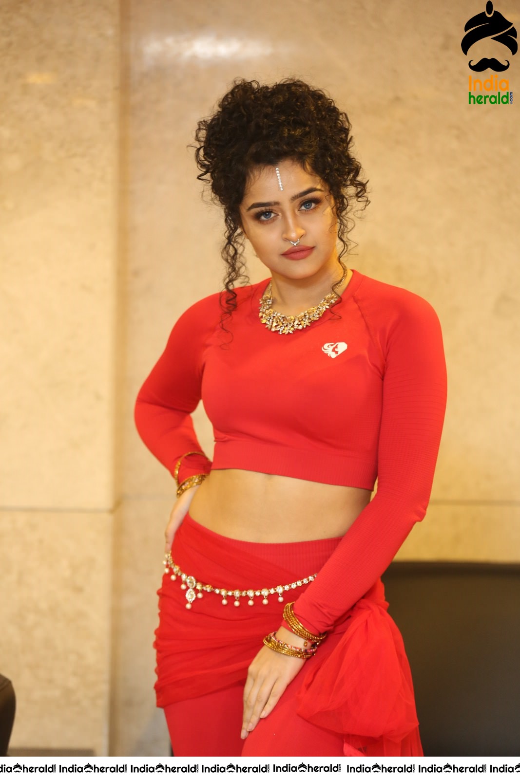 Ankeeta Shows her Teasing Waistline in Red Costume Set 2