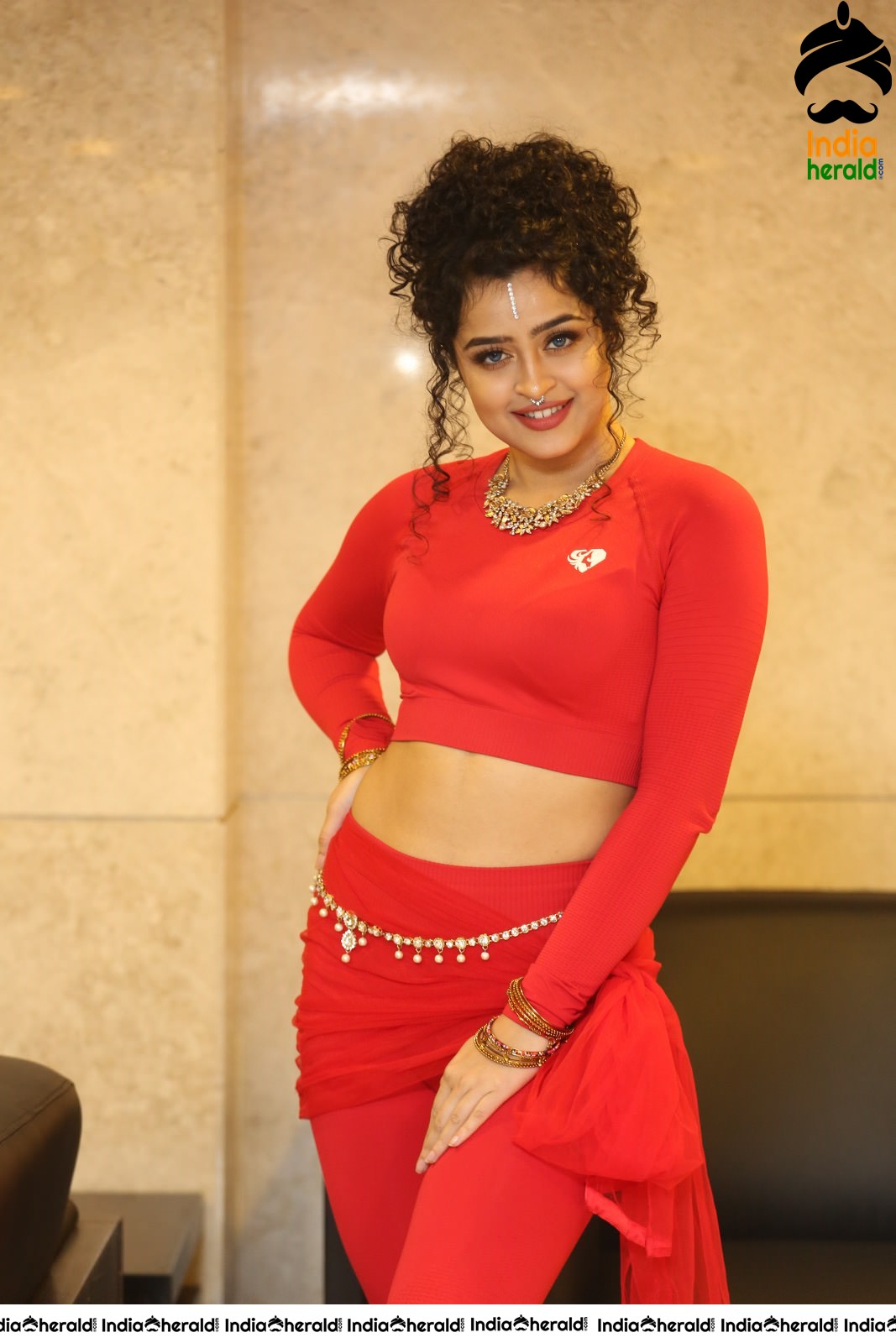 Ankeeta Shows her Teasing Waistline in Red Costume Set 2