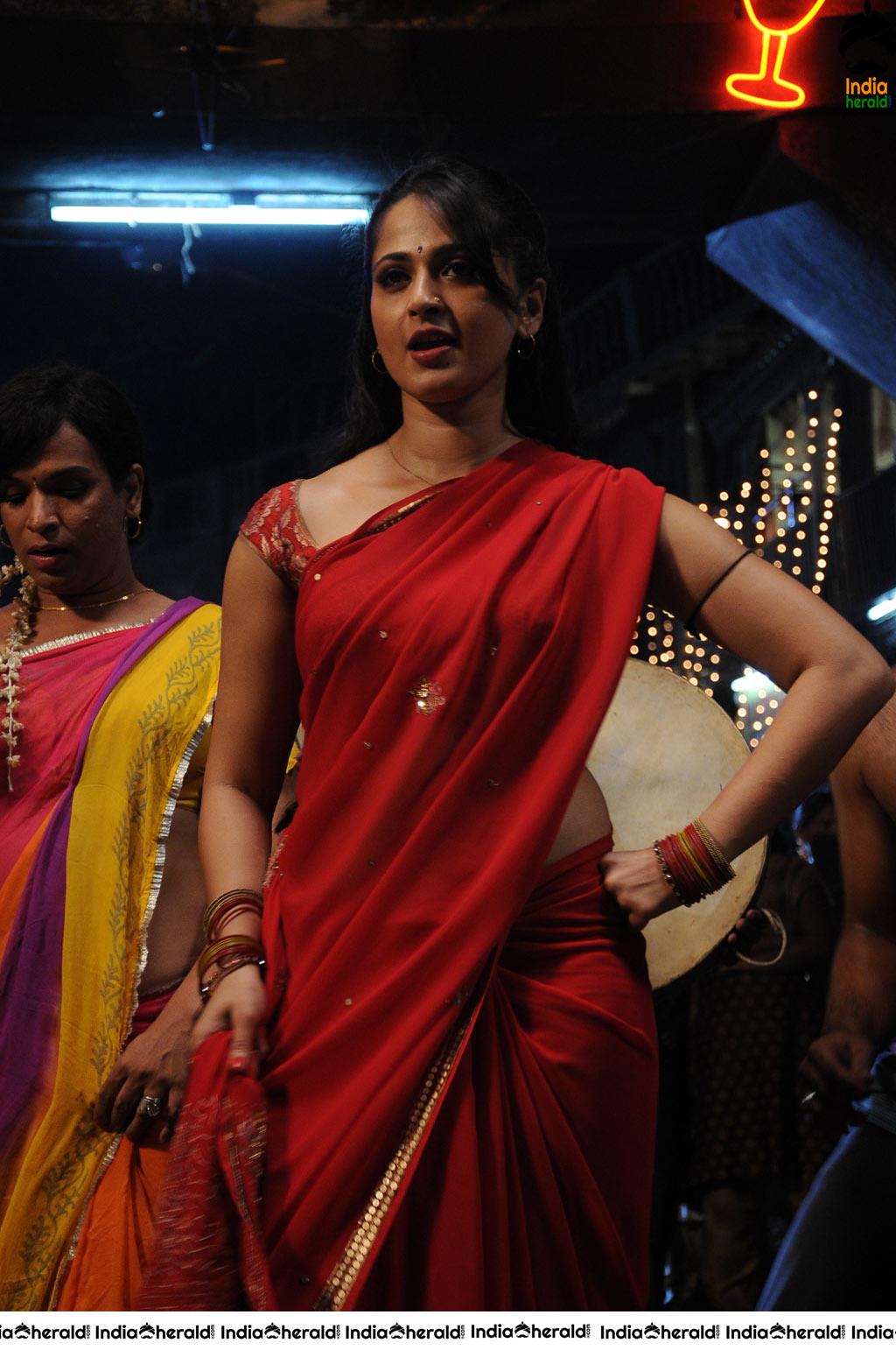 Anushka Sizzling Hot in Red Saree Stills from Vaanam movie Set 1