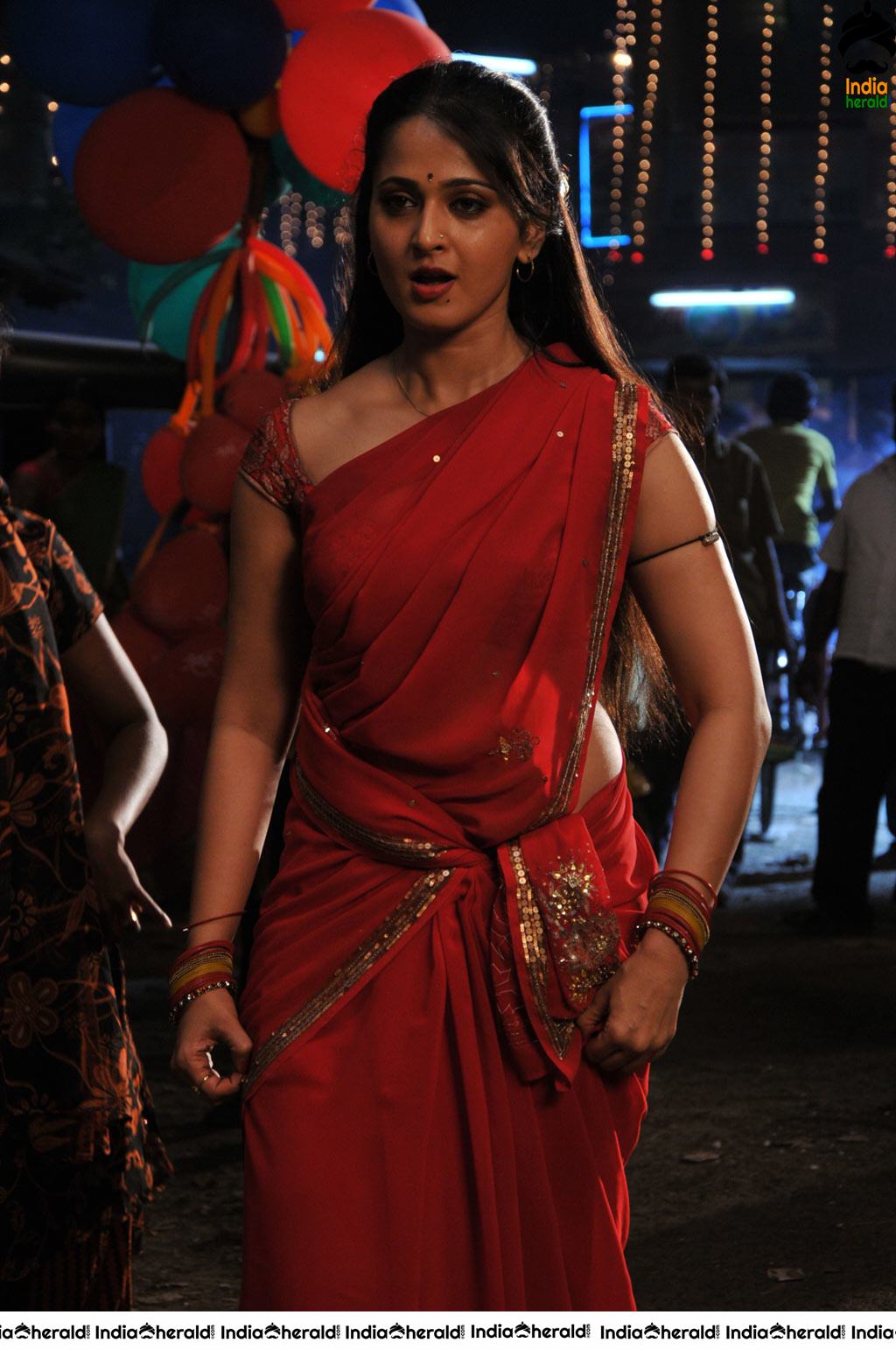 Anushka Sizzling Hot in Red Saree Stills from Vaanam movie Set 2