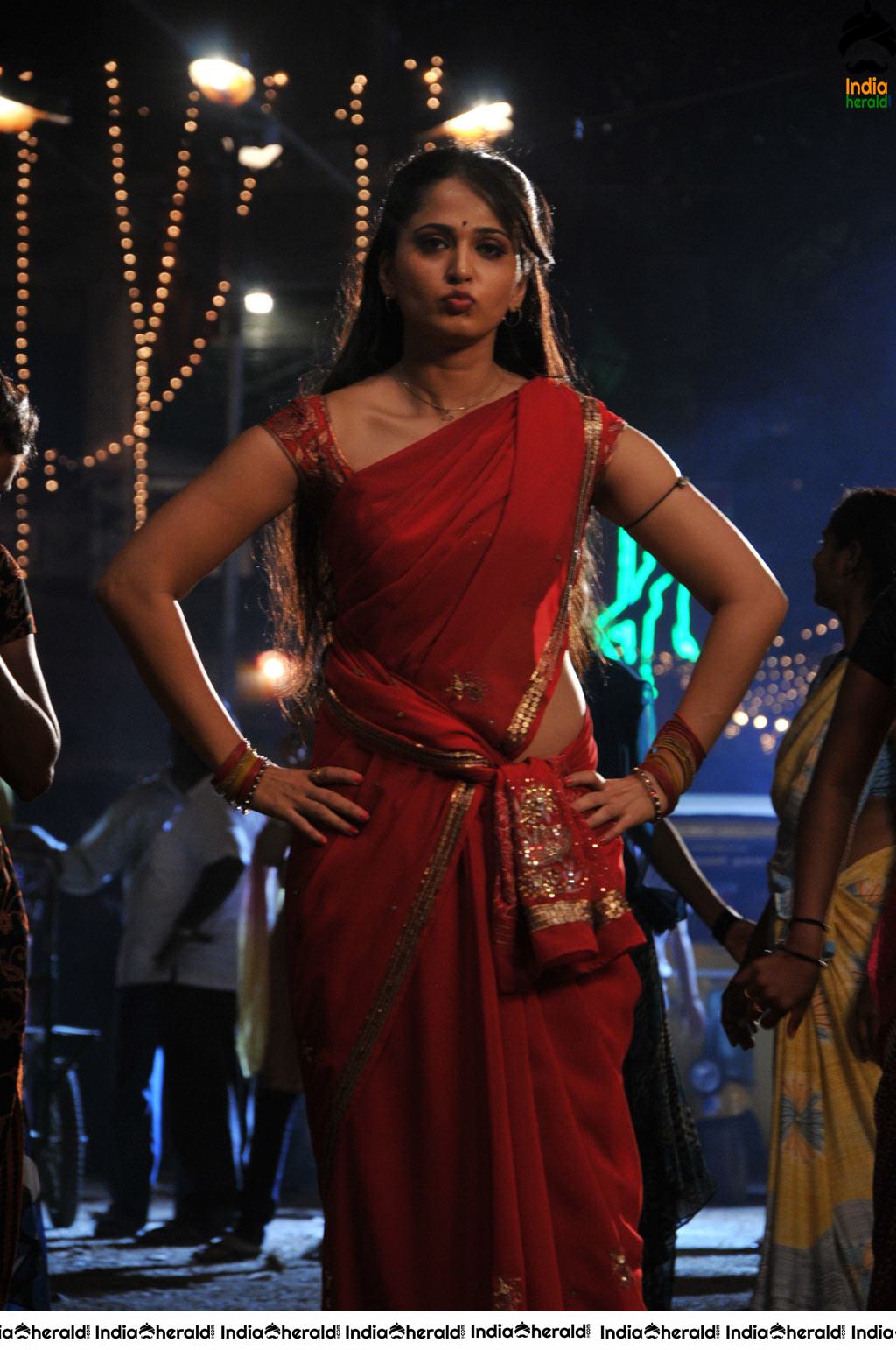 Anushka Sizzling Hot in Red Saree Stills from Vaanam movie Set 2