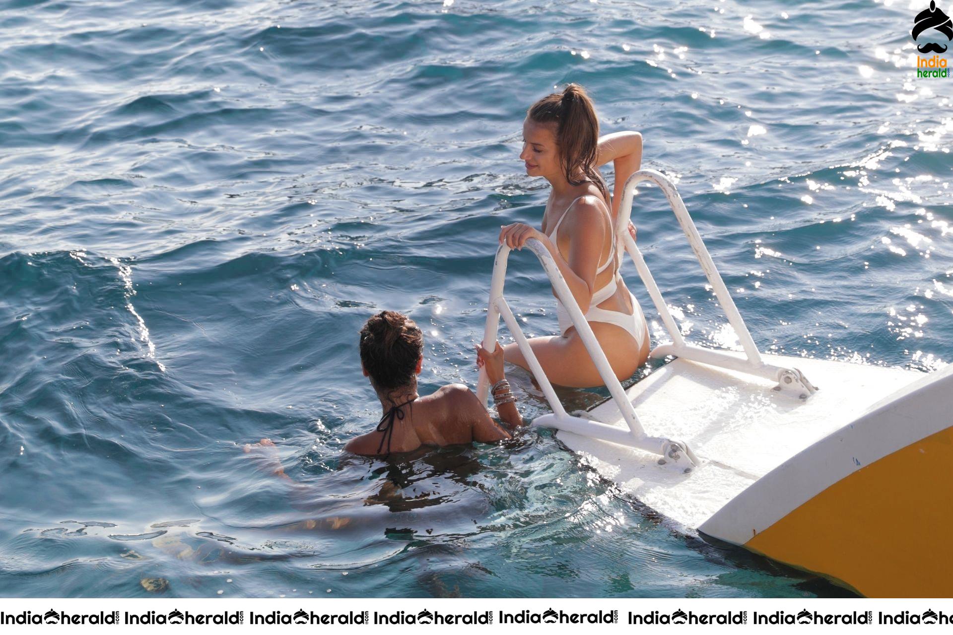 CJ Franco and Natalia Janoszek take a deep in the Caribbean Sea while vacationing in Jamaica