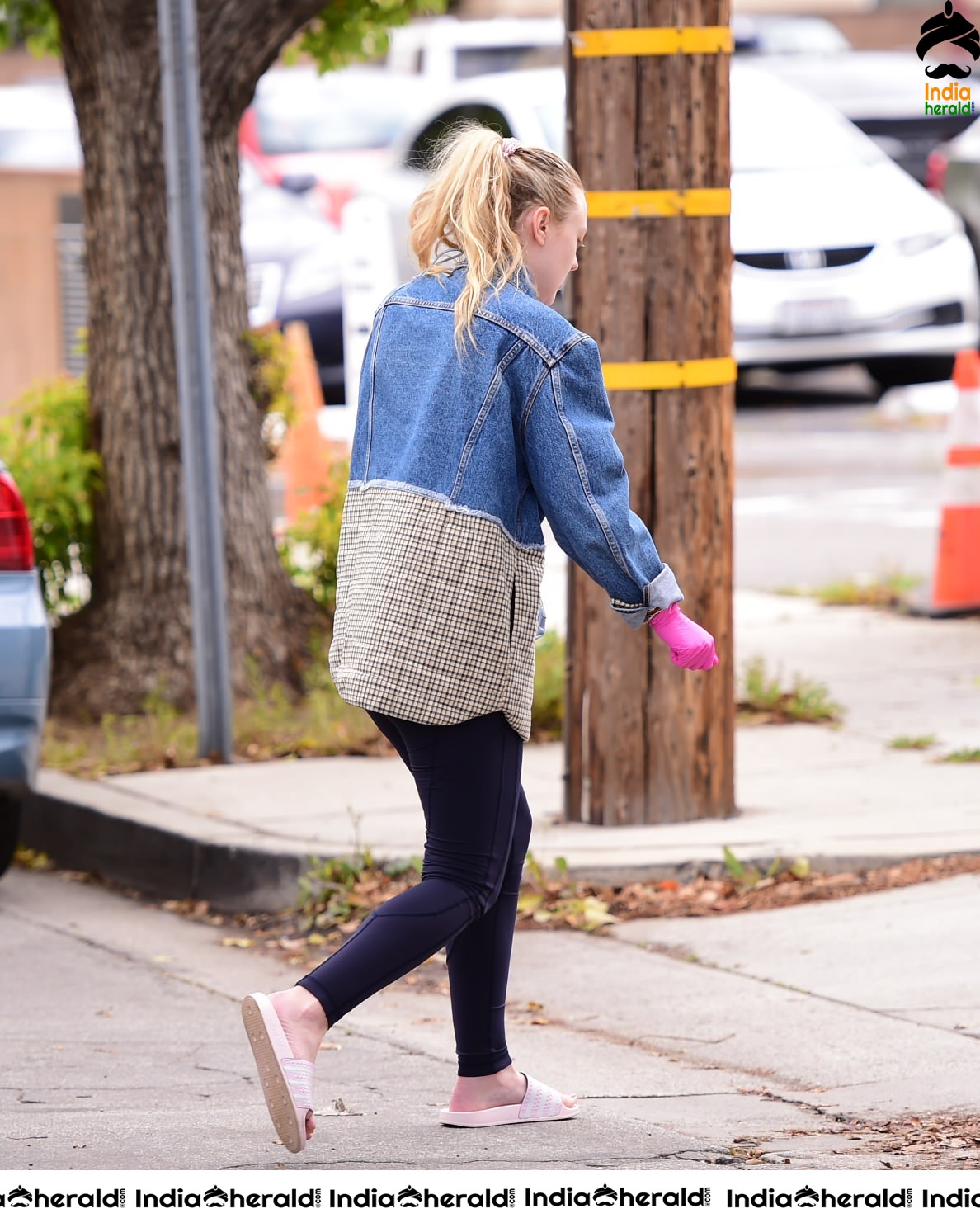 Dakota Fanning Wears pink surgical gloves while stepping out in Los Angeles