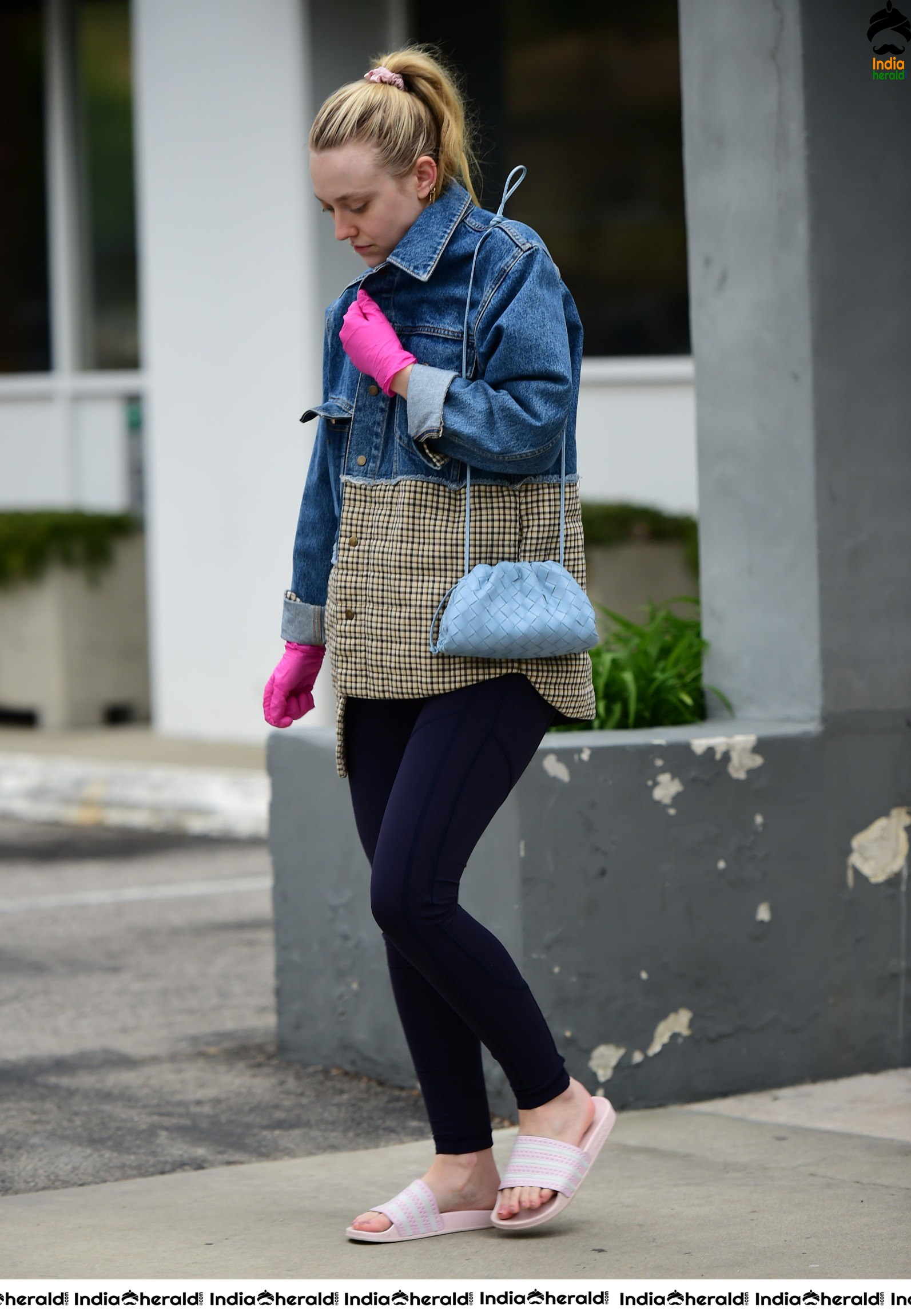 Dakota Fanning Wears pink surgical gloves while stepping out in Los Angeles