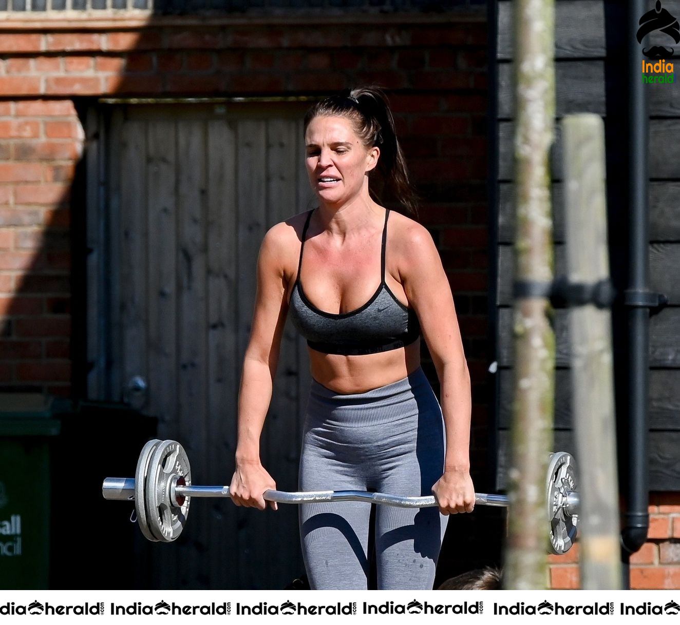 Danielle Lloyd in hot gym dress and trains on her drive in Liverpool