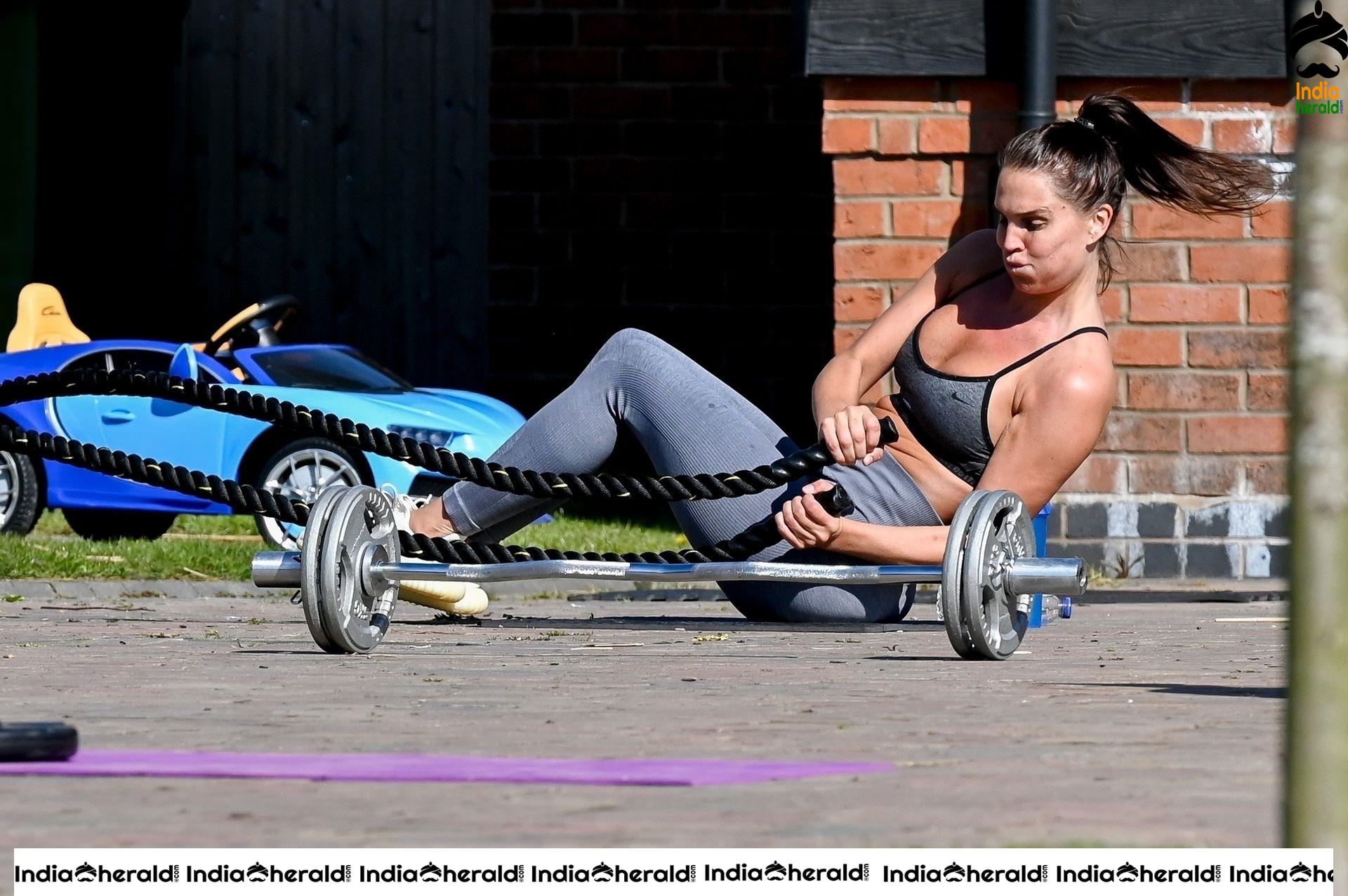 Danielle Lloyd in hot gym dress and trains on her drive in Liverpool