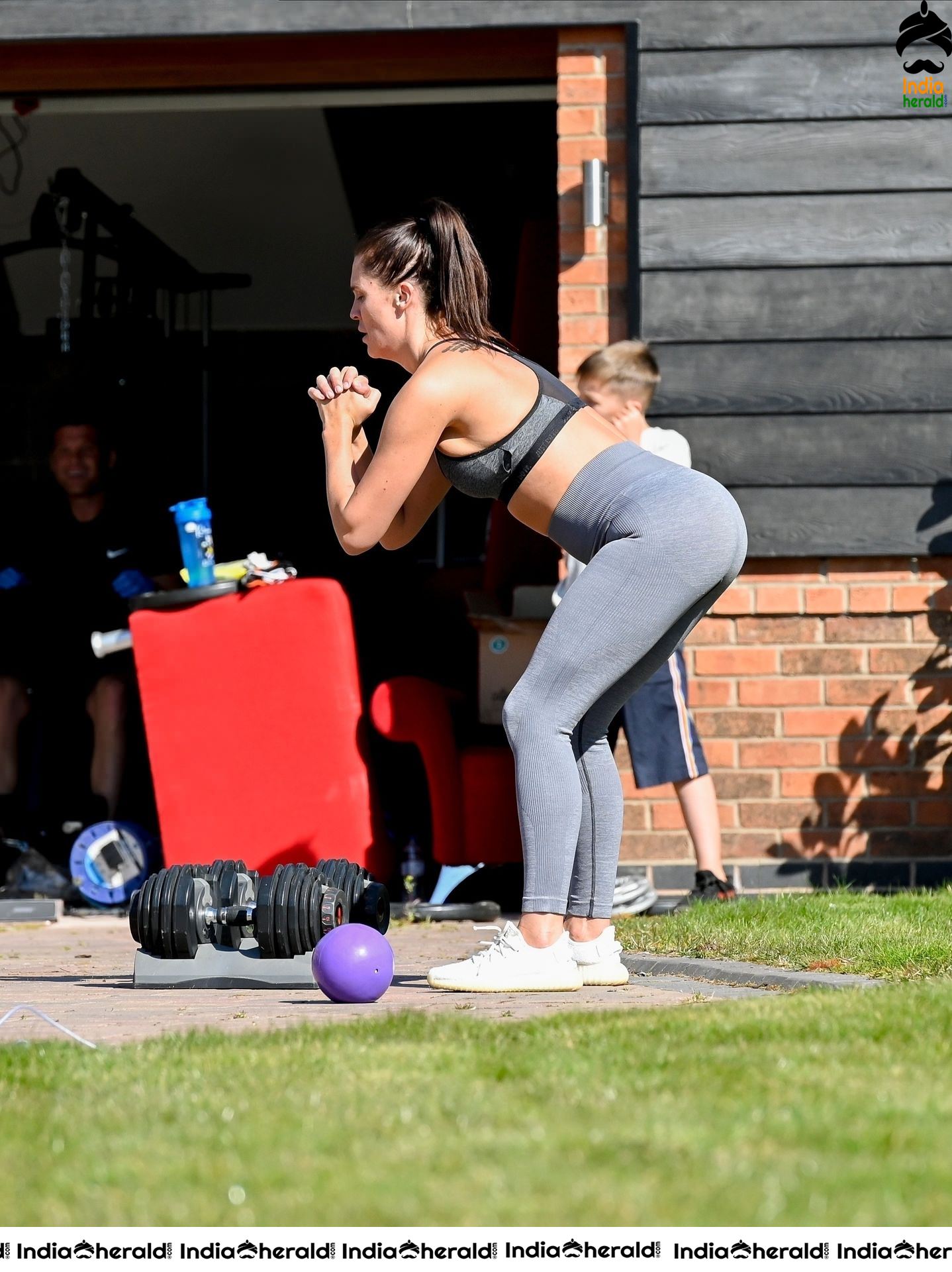 Danielle Lloyd in hot gym dress and trains on her drive in Liverpool