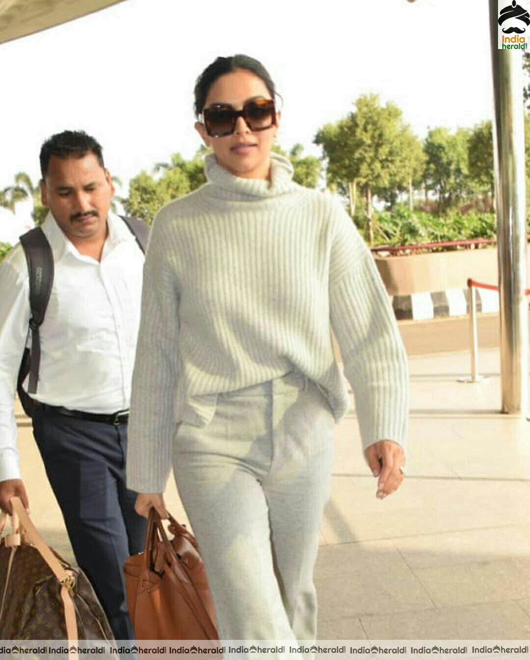 Deepika in her Winter outfit at Mumbai Airport