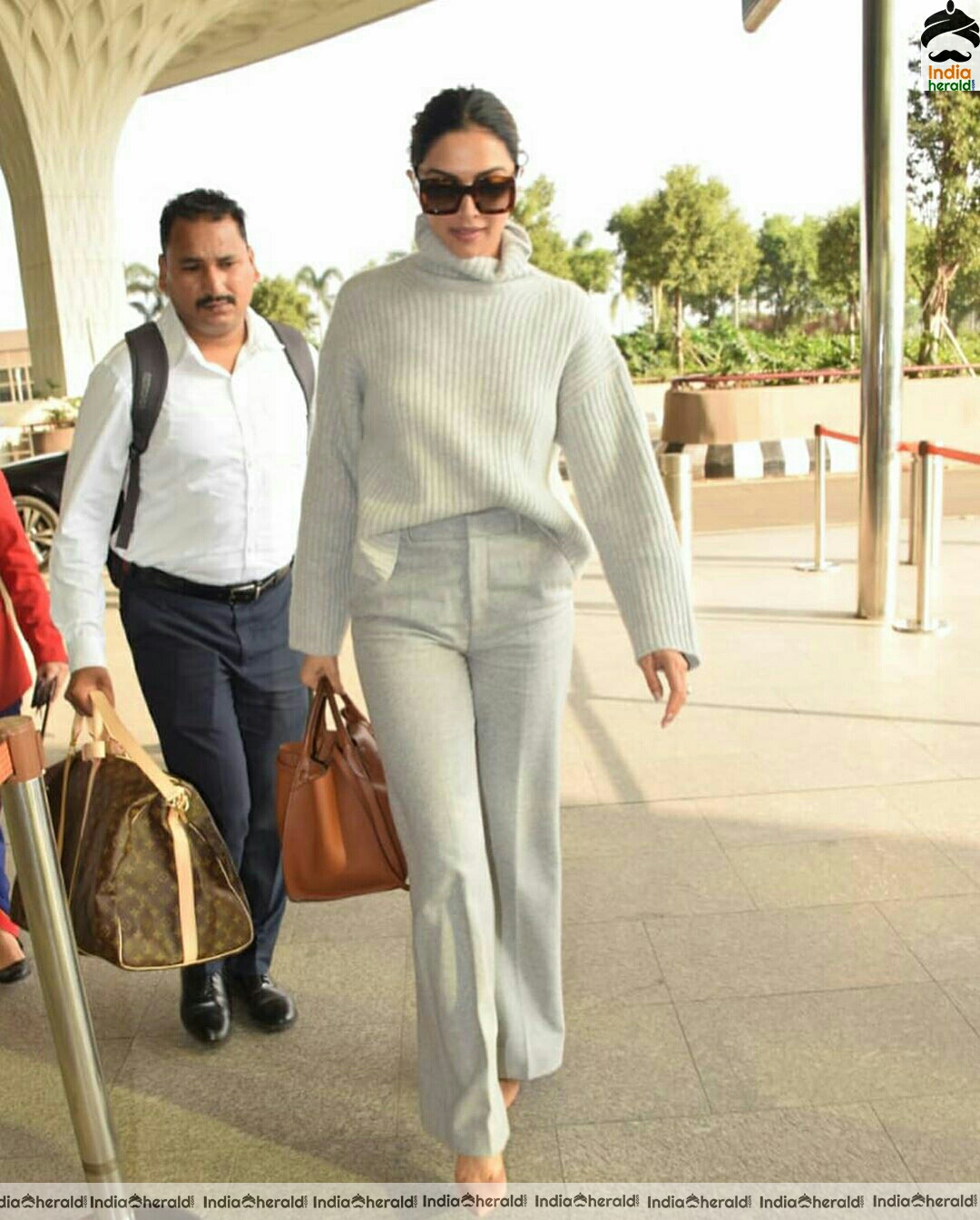 Deepika in her Winter outfit at Mumbai Airport