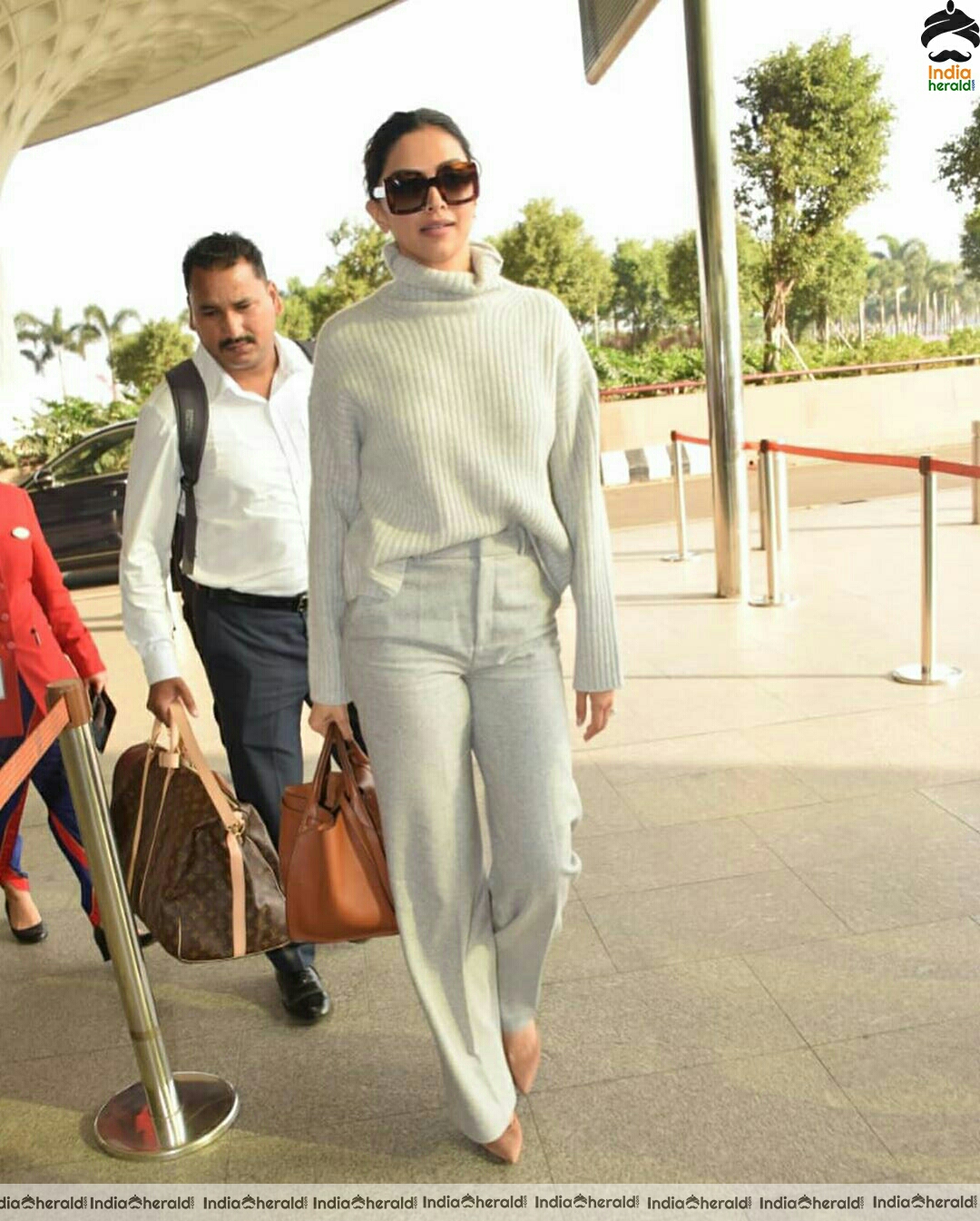 Deepika in her Winter outfit at Mumbai Airport