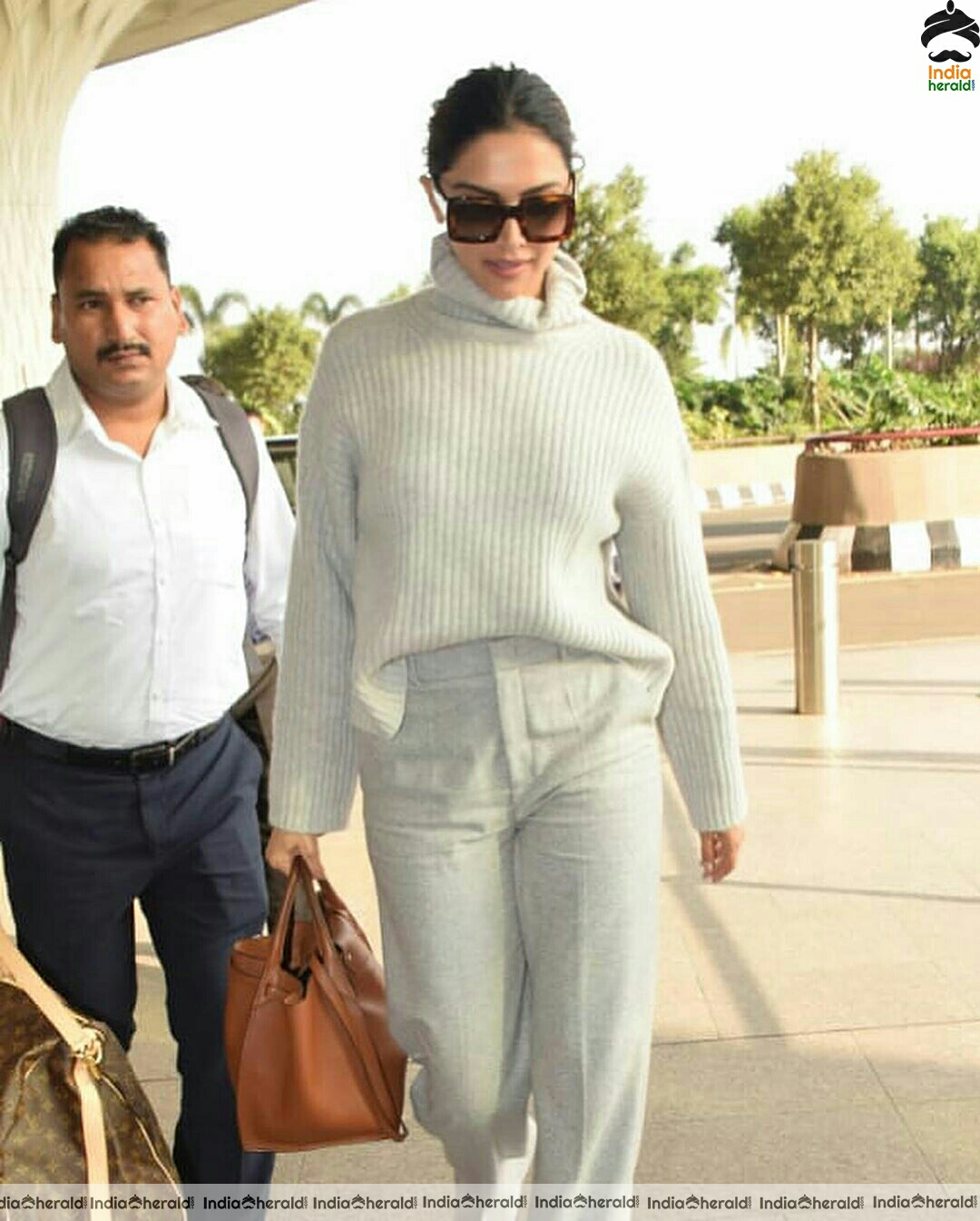 Deepika in her Winter outfit at Mumbai Airport