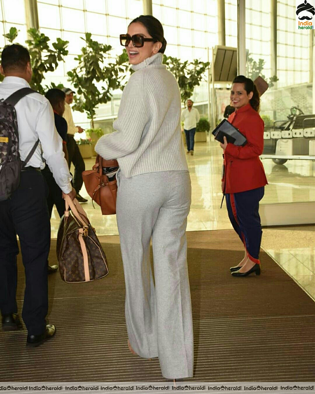 Deepika in her Winter outfit at Mumbai Airport